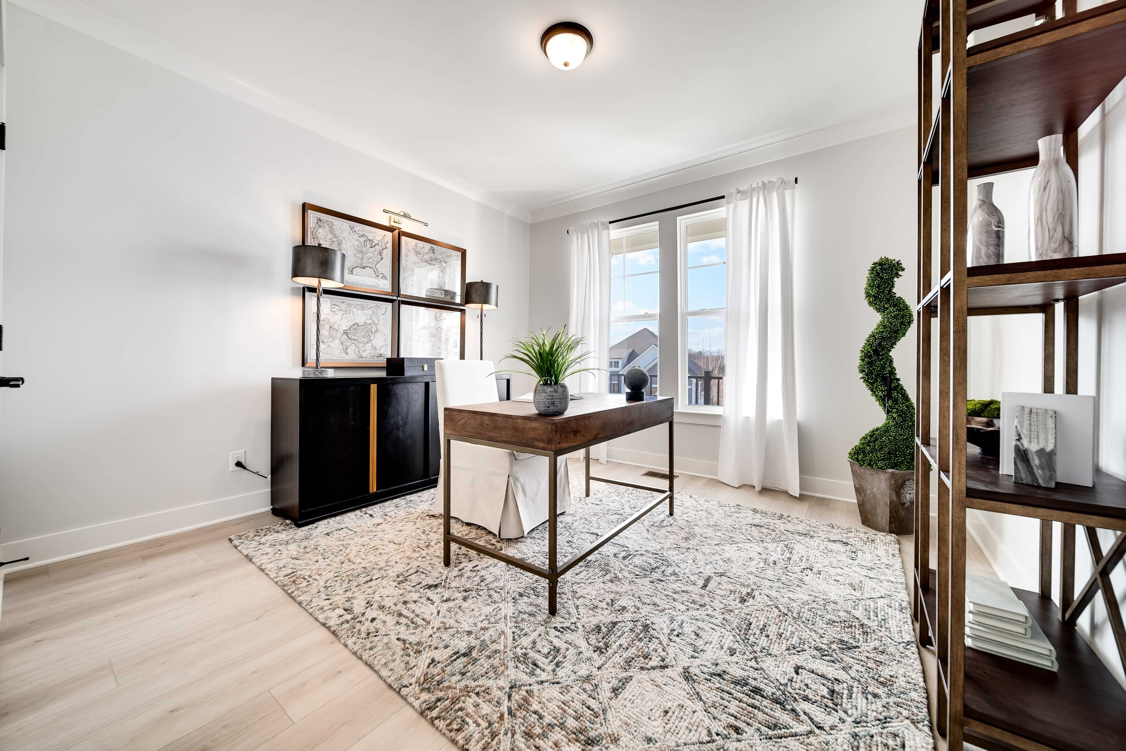 Elegant Home Office in Richvale Estates with Modern Decor Modern home office with elegant desk, art, large windows in Richvale Estates. Bright, minimalist decor, wood shelving.