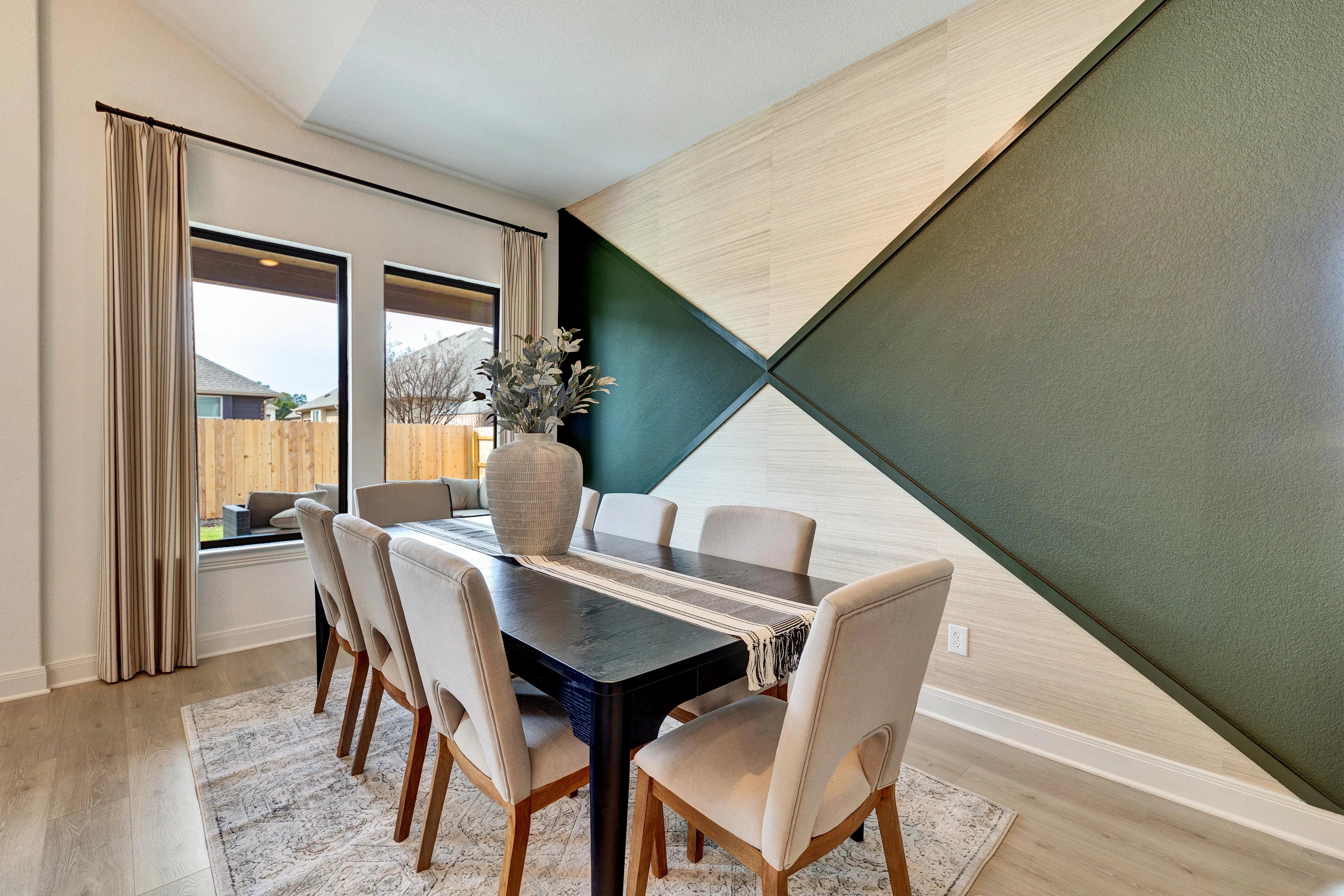 Hawkes Landing Dining Room with Modern Wall Design Elegant dining room with modern wall panel design, large windows, neutral tones, Hawkes Landing.