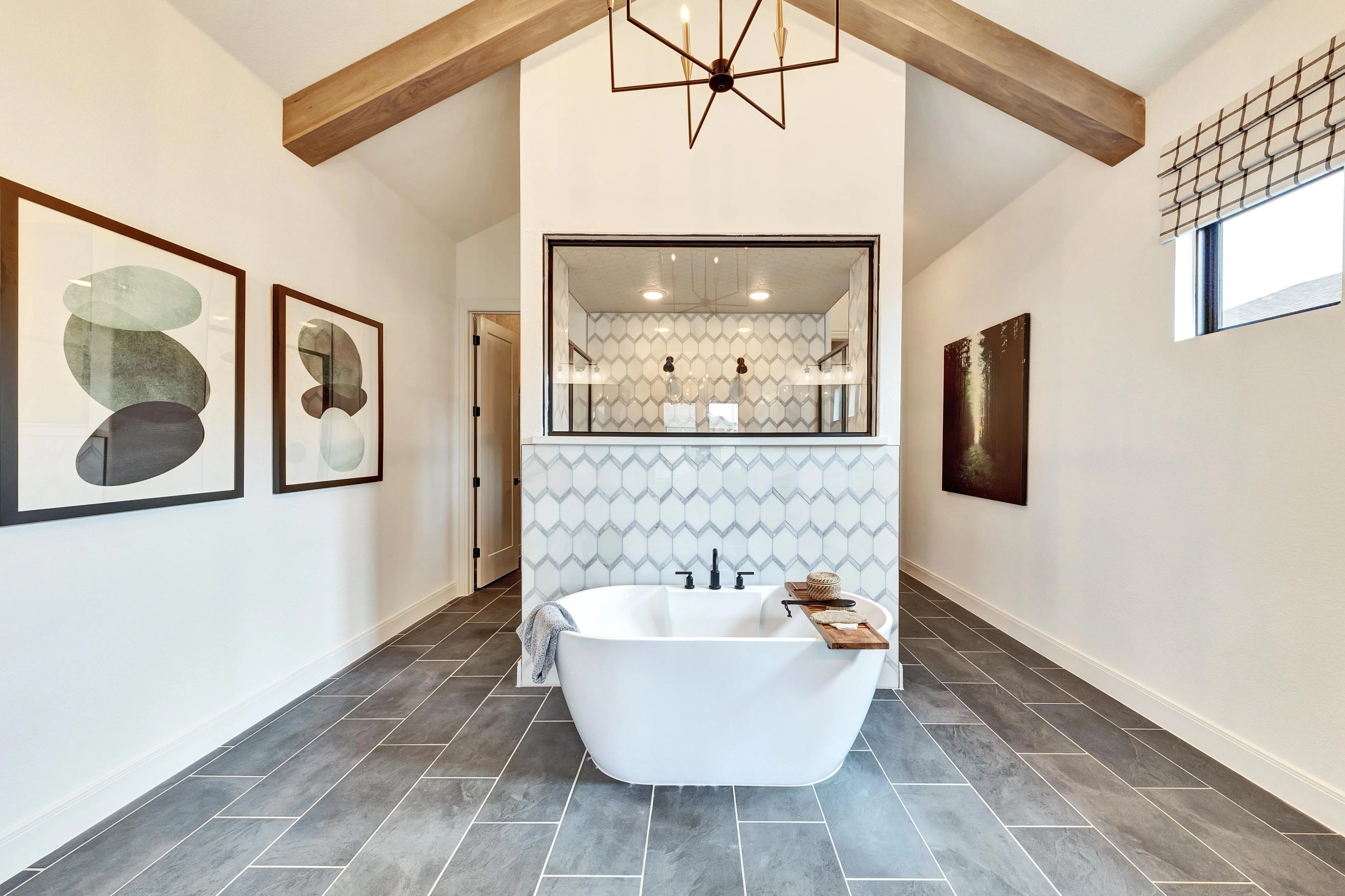 Hawkes Landing Luxury Bathroom with Freestanding Tub and Geometric Tiles Luxurious Hawkes Landing bathroom with freestanding tub, geometric tiles, exposed beam, modern chandelier. High-end design.