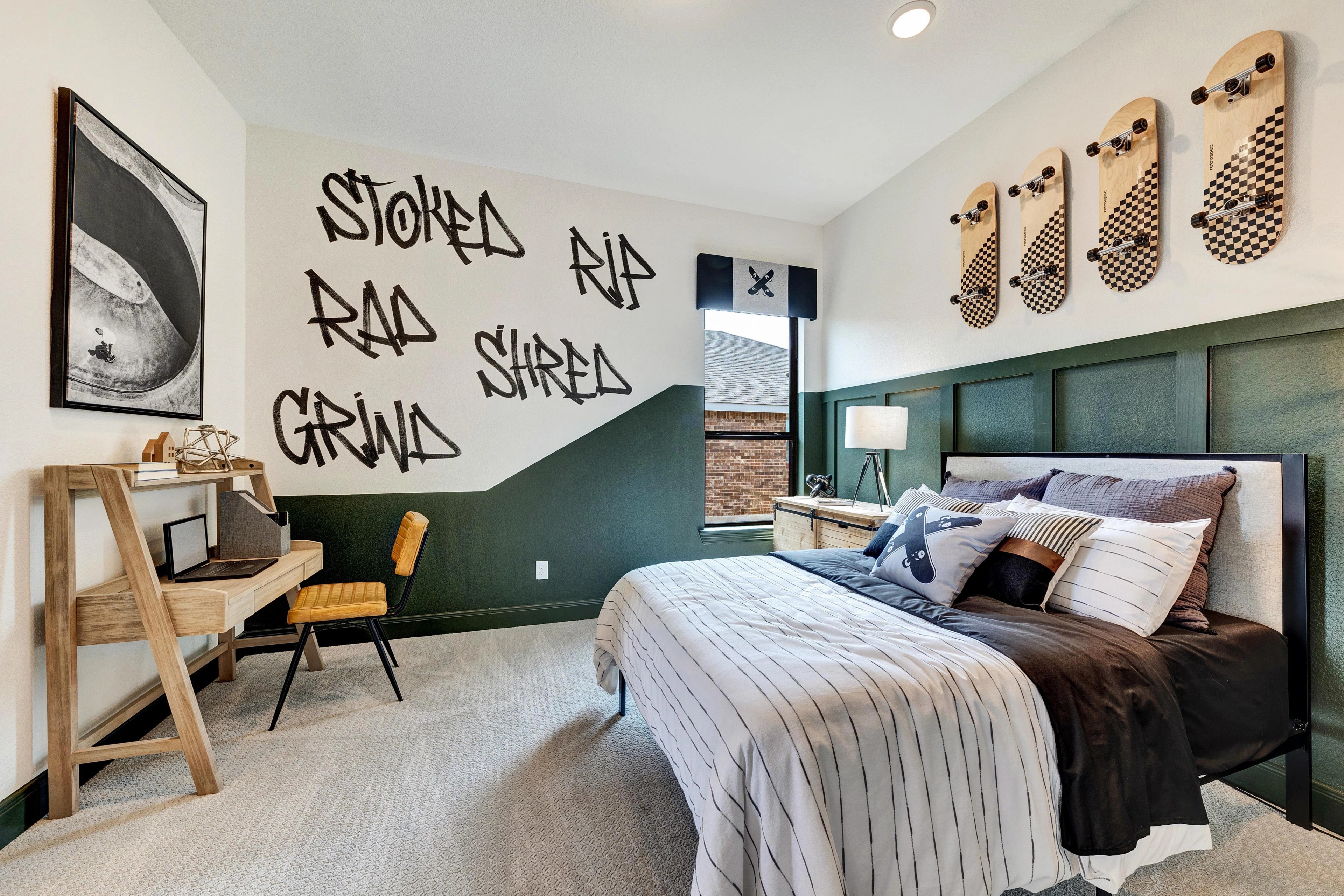 Teen Bedroom with Skateboard Theme in Hawkes Landing Stylish teen bedroom with skateboard theme, graffiti wall, wood desk, green accents, Hawkes Landing.