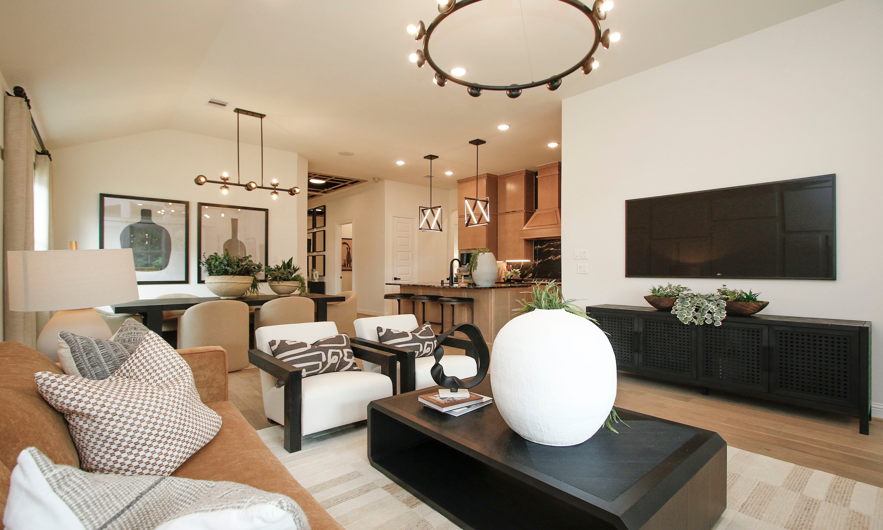 Elegant Open Living Room in Woodlands Hills Community Modern open living space with elegant lighting and designer furniture in Woodlands Hills community.