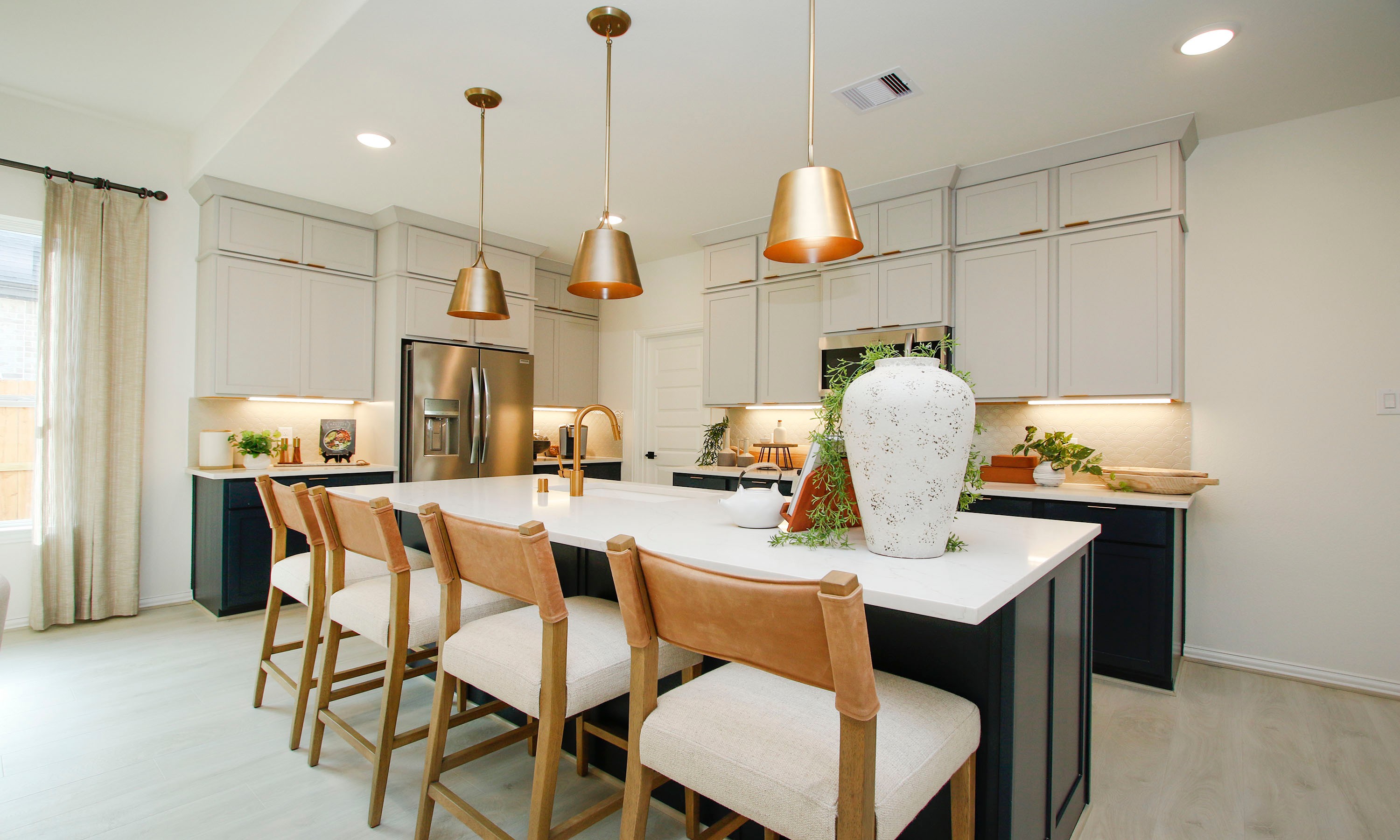 Contemporary Kitchen Design in The Woodlands Hills Modern kitchen with island, pendant lights, and stainless appliances in The Woodlands Hills community.