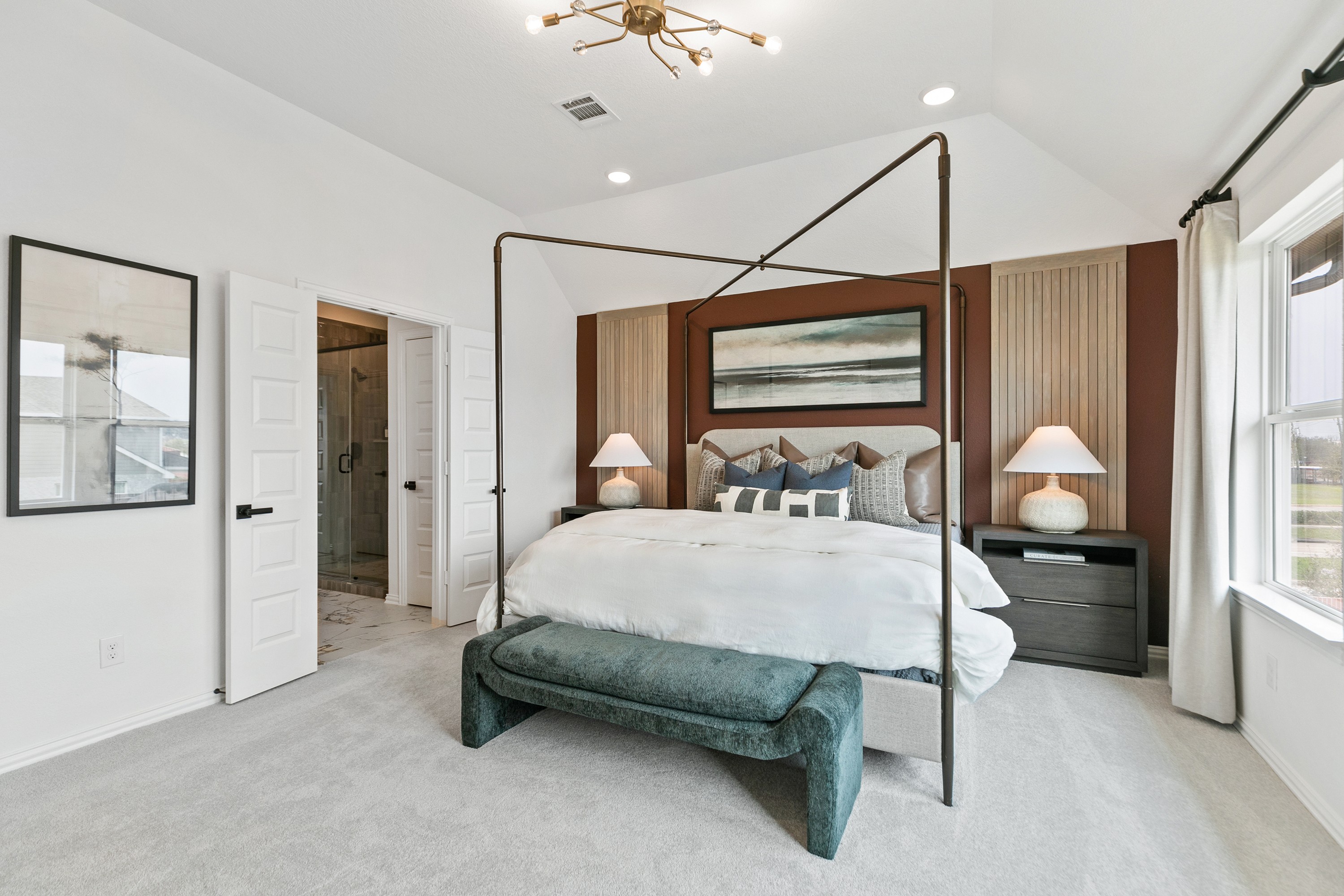 Luxury Bedroom with Four-Poster Bed in Park at Eldridge Elegant bedroom features a four-poster bed and chic lighting in Park at Eldridge, with a view of the outdoor landscape.