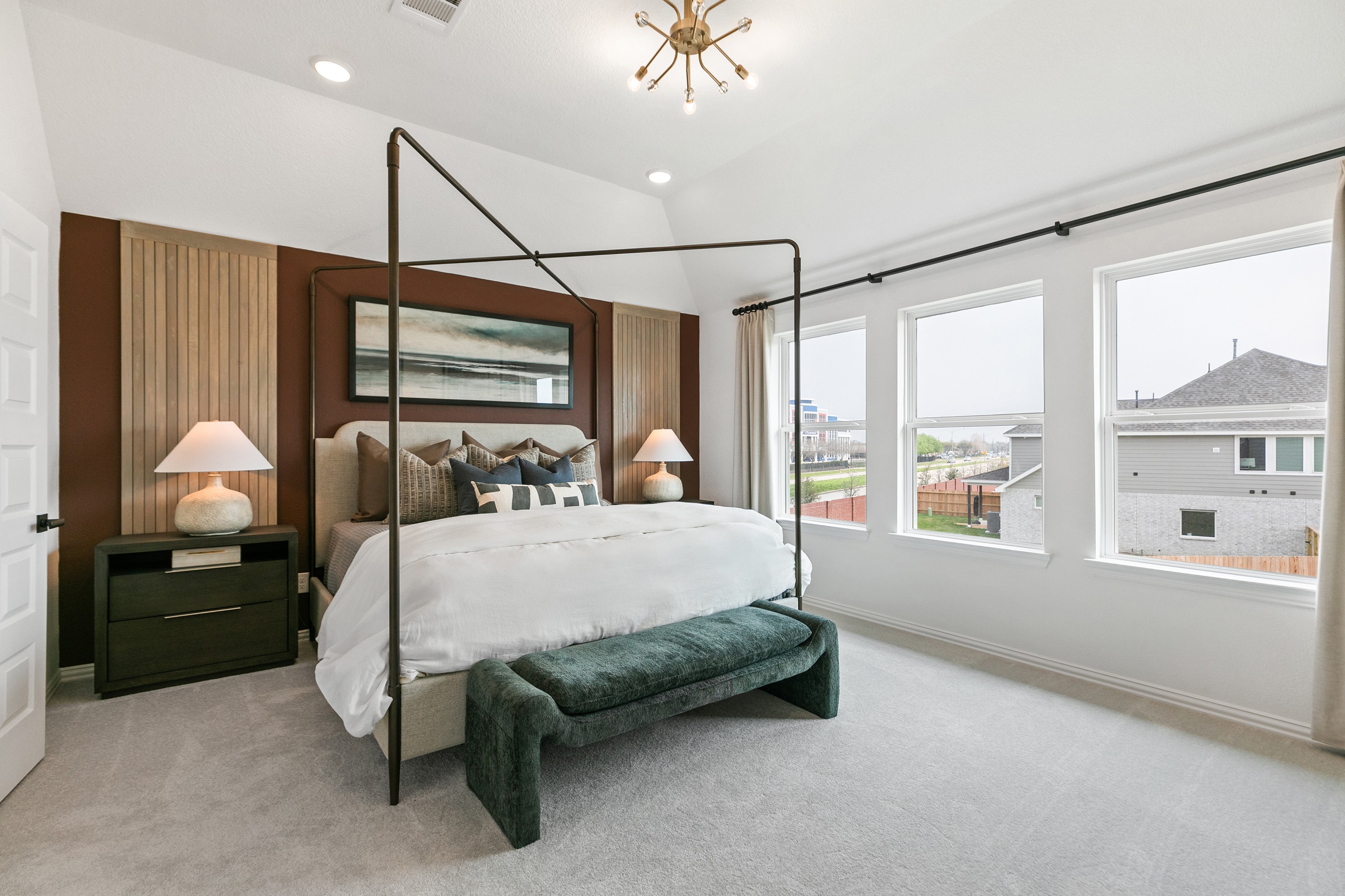 Modern Bedroom with Canopy Bed in Park at Eldridge Community Elegant bedroom with canopy bed, panoramic windows, and modern lighting in Park at Eldridge community.