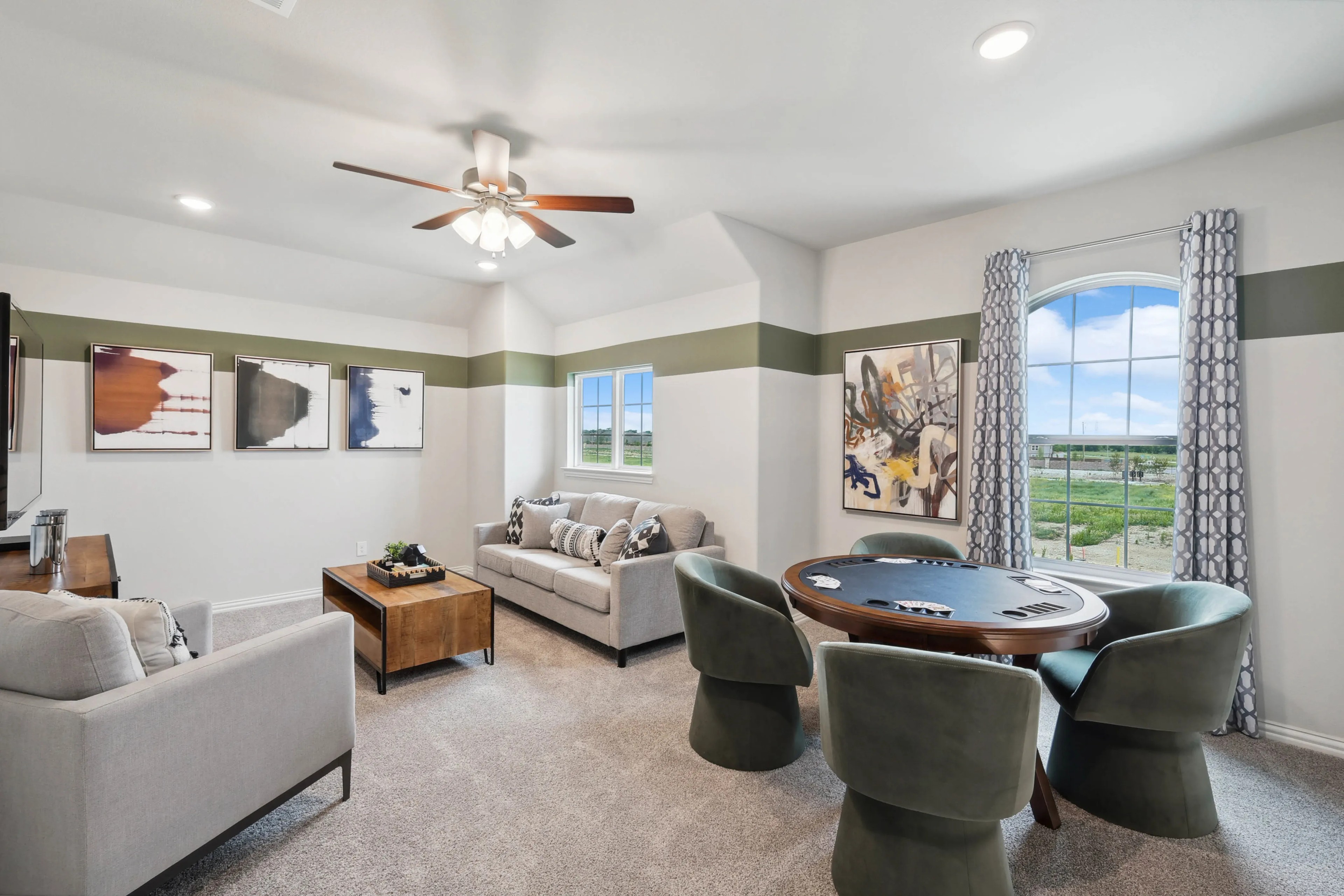 Luxurious Game Room with Modern Decor in Hulen Trails, Texas Elegant game room with modern decor, poker table, abstract art, large window views in Hulen Trails, Texas.