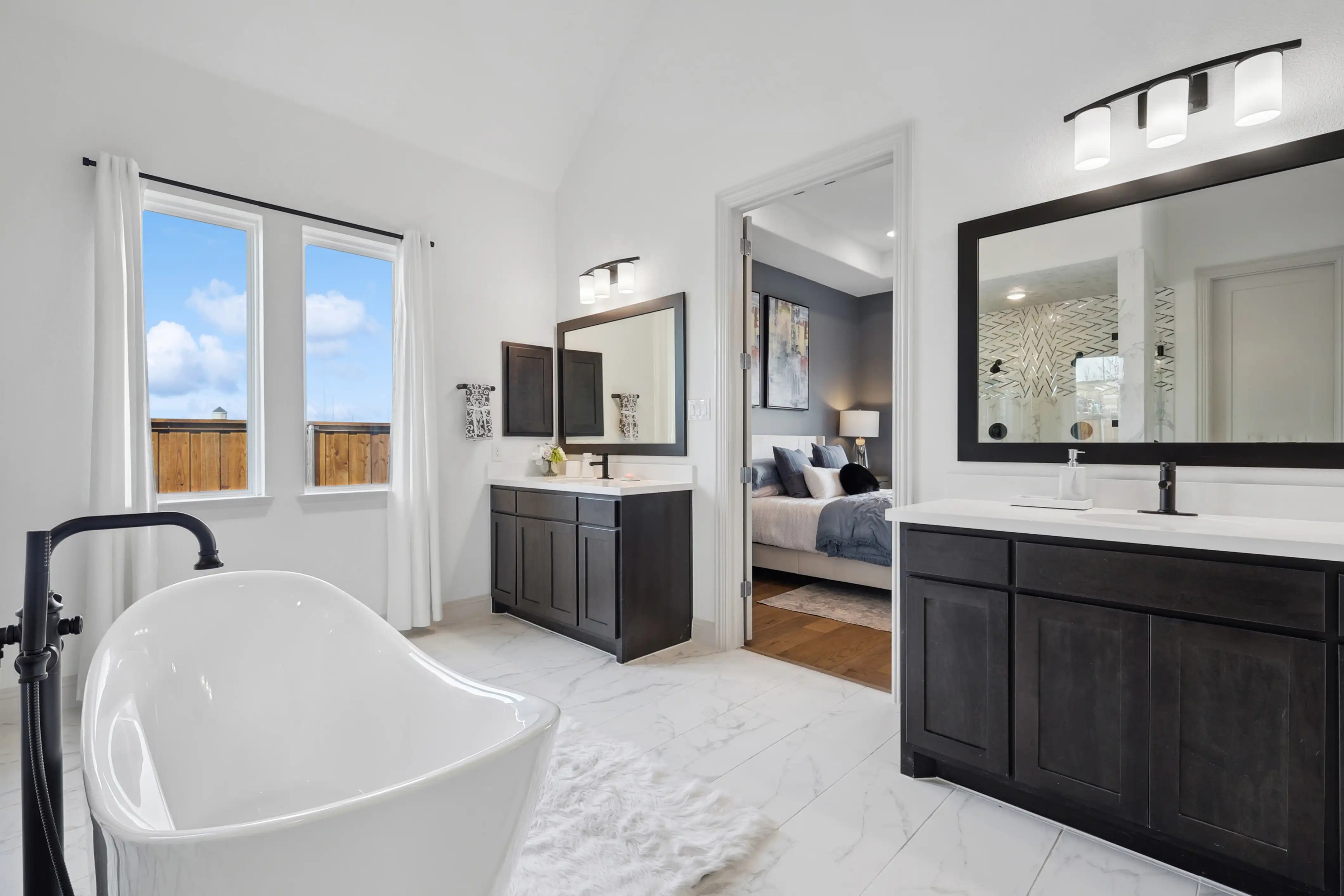 Elegant Bathroom with Freestanding Tub in Westside Preserve Spacious bathroom with freestanding tub, dual vanities, modern decor in Westside Preserve home.