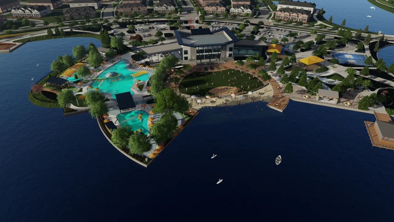 Aerial View of Solterra Texas Community Clubhouse and Pools Aerial view of Solterra Texas community, showcasing a modern clubhouse, pools, and landscaped waterfront area.