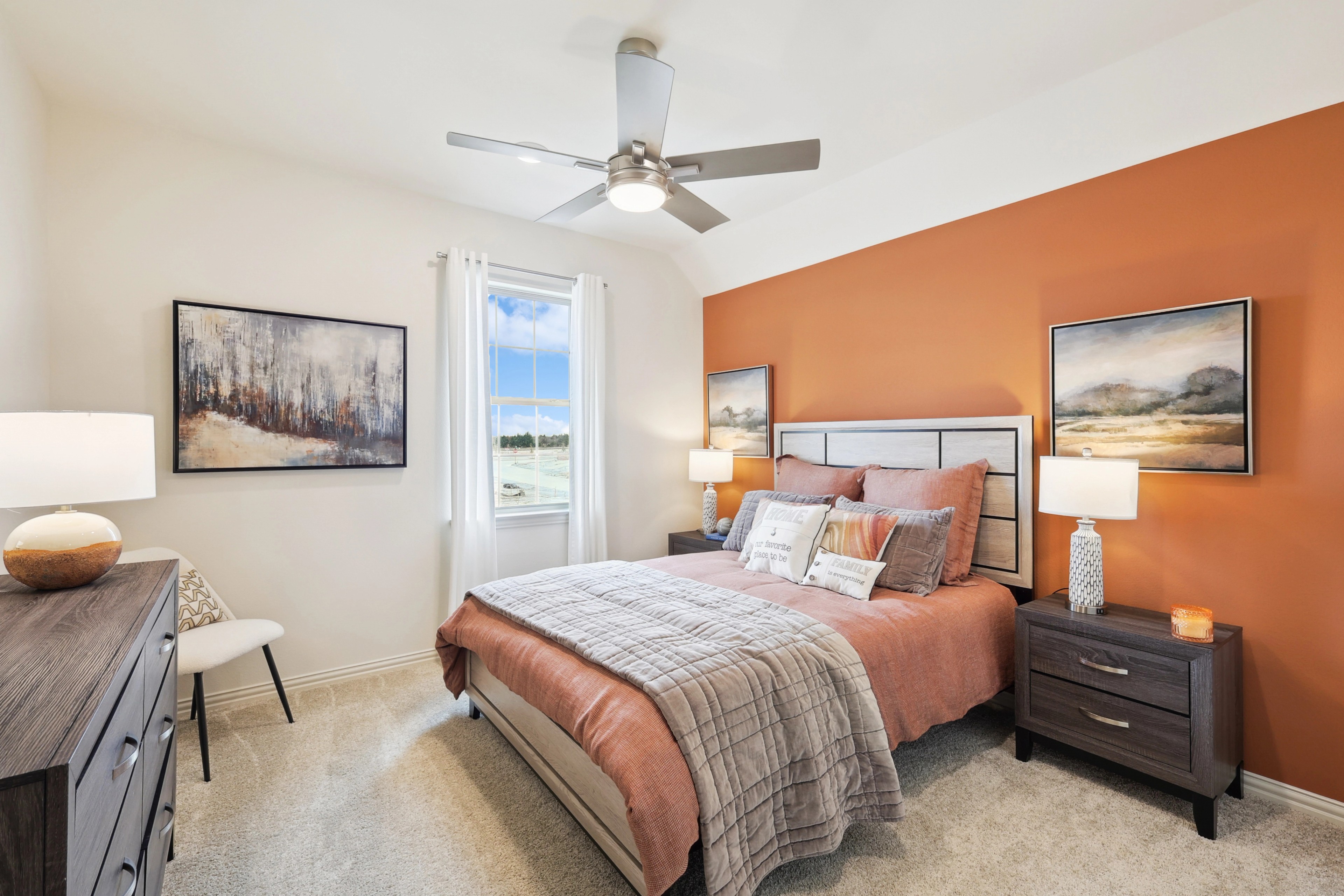 Luxurious Bedroom Design in The Oaks Community Luxurious bedroom with orange accent wall, elegant decor in The Oaks community.
