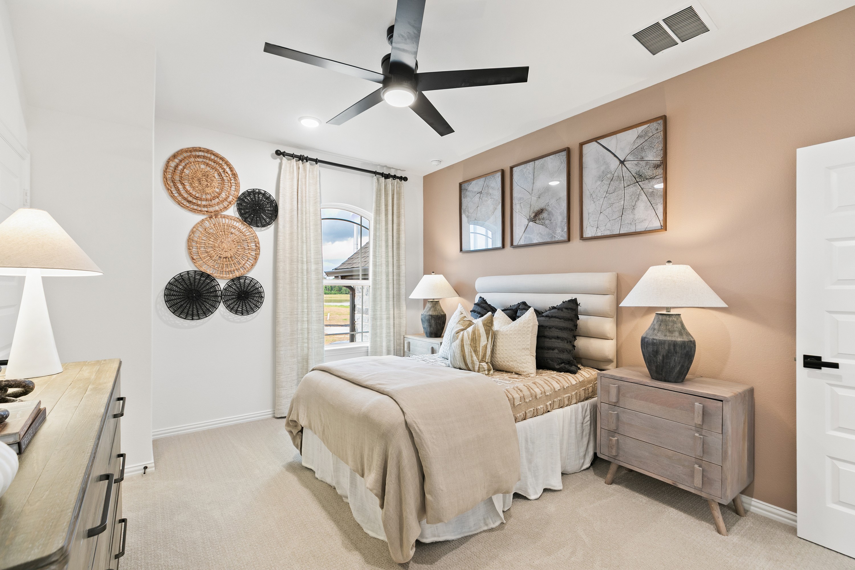 Luxury Bedroom Design in Katy Lakes with Modern Decor Elements Elegant bedroom in Katy Lakes with modern decor, plush bed, artful wall decor, and soft lighting. Neutral tones dominate.