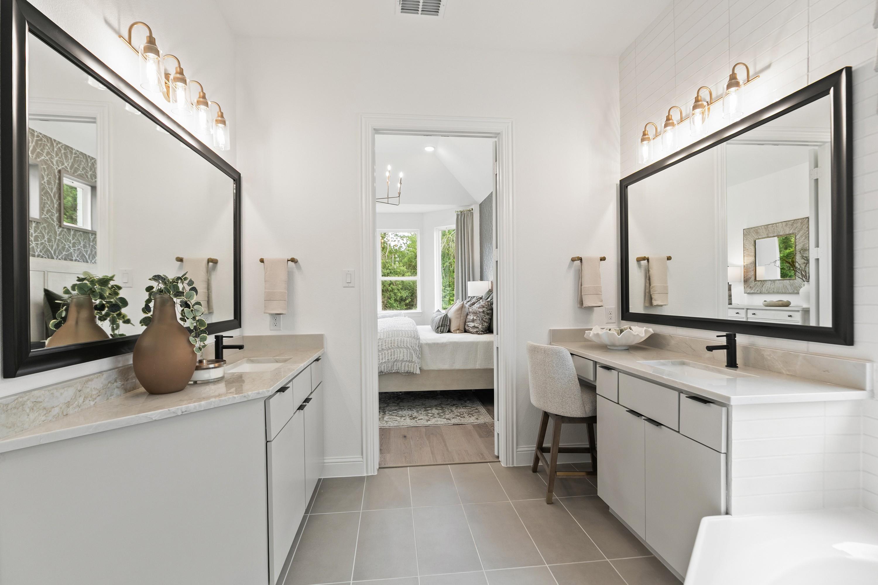 Elegant Bathroom with Dual Vanities and Bedroom View, Katy Lakes Luxurious bathroom with double vanities, modern mirrors, elegant lighting, and bedroom view at Katy Lakes.