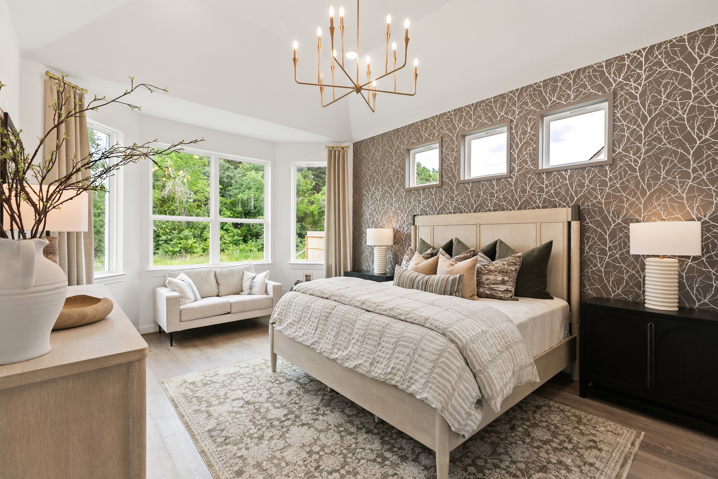 Elegant Bedroom in Katy Lakes with Modern Chandelier and Large Windows Luxurious bedroom with modern chandelier, designer wallpaper, and large windows in Katy Lakes community.