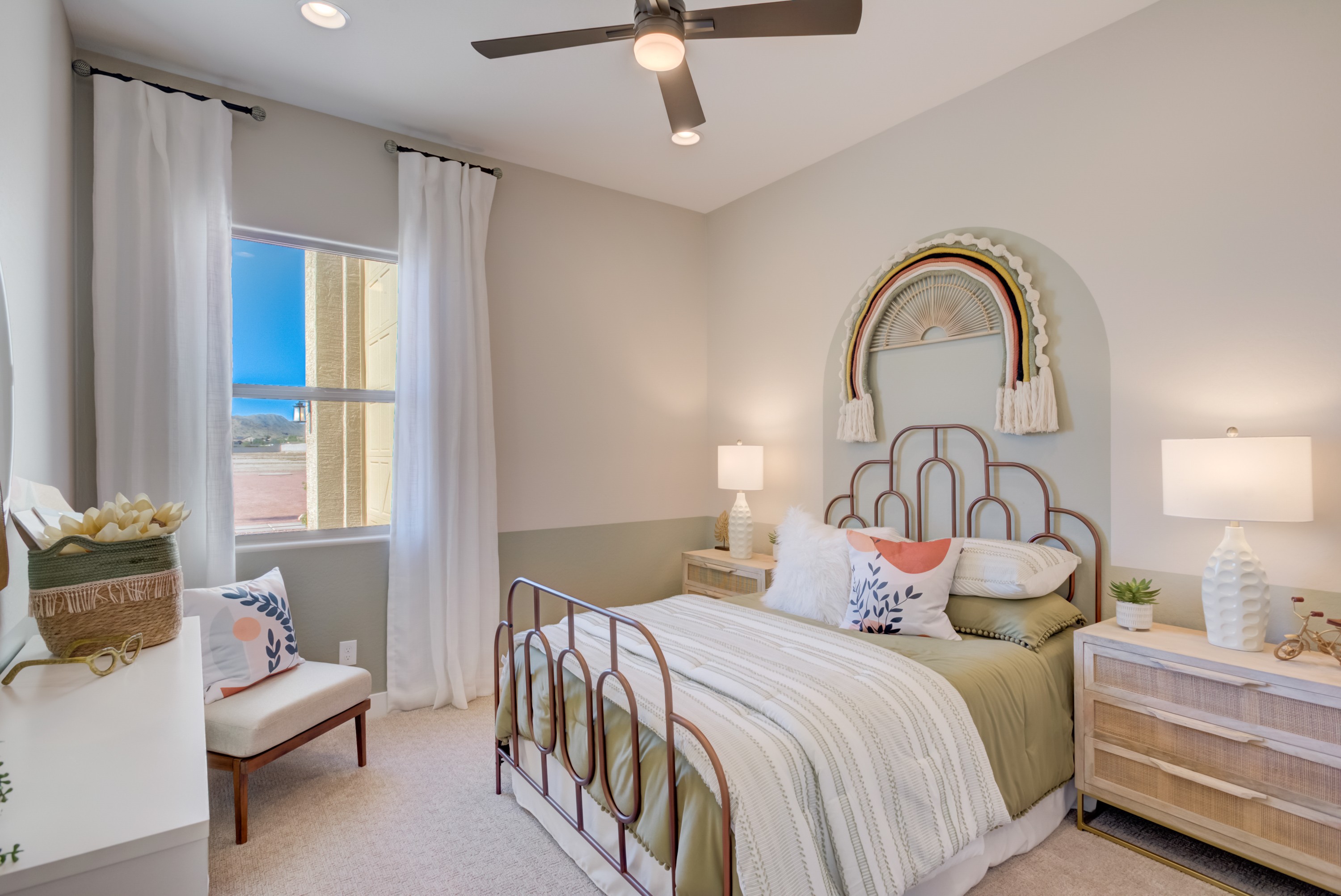 Stylish Bedroom Design at Arroyo Seco Palazzo Cozy bedroom with stylish metal bed, woven decor, and natural light at Arroyo Seco Palazzo.