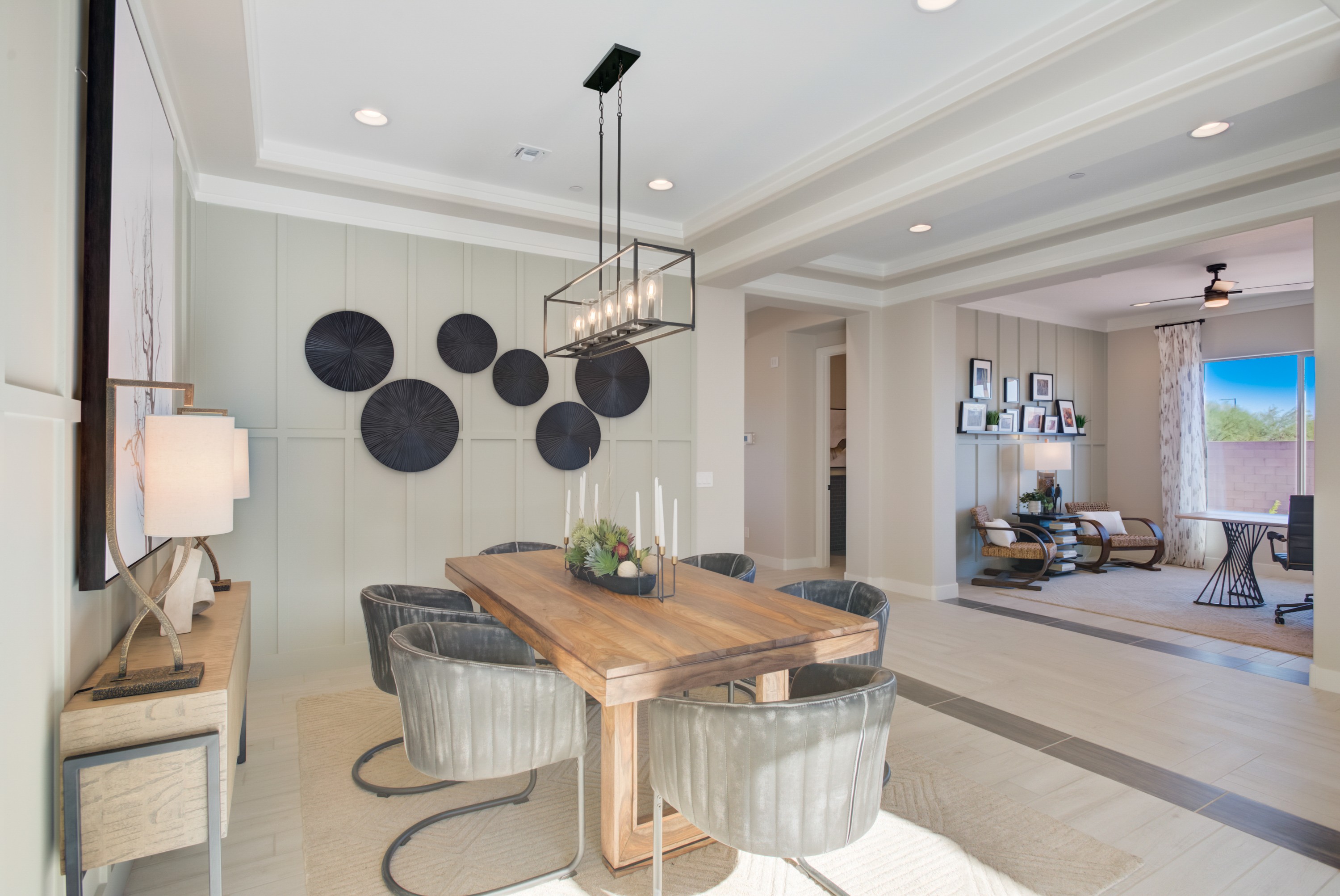 Modern Dining Room with Geometric Wall Art in Arroyo Seco, Arizona Modern dining room with wood table, sleek chairs, and geometric wall art in Palazzo community, Arroyo Seco, Arizona.