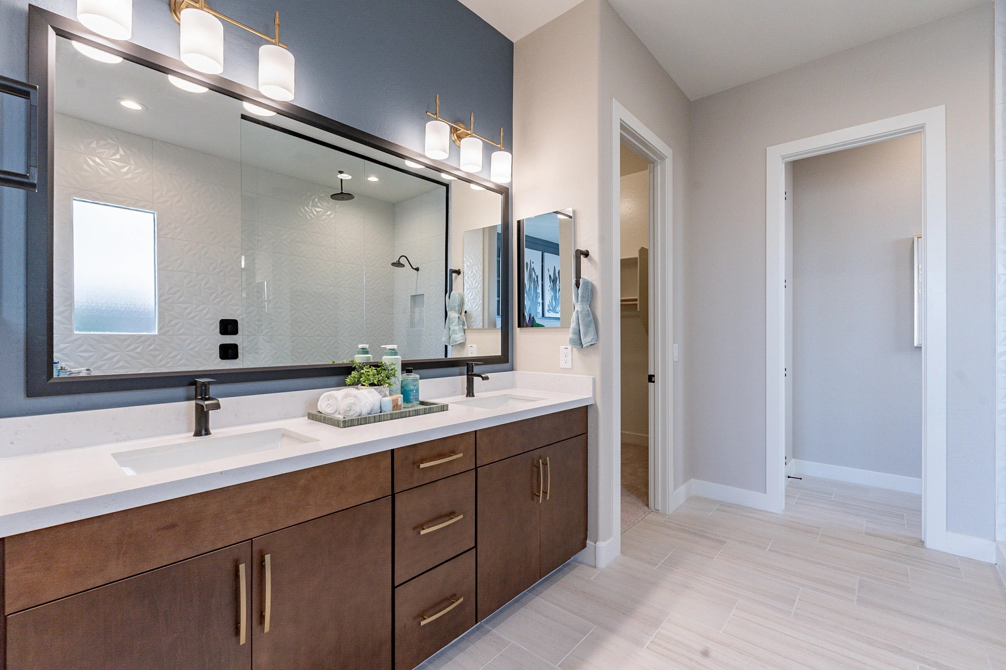 Arroyo Seco Hacienda Luxury Bathroom - Double Vanity and Shower Luxury bathroom with double vanity, elegant fixtures, walk-in shower, in Arroyo Seco, Hacienda community.