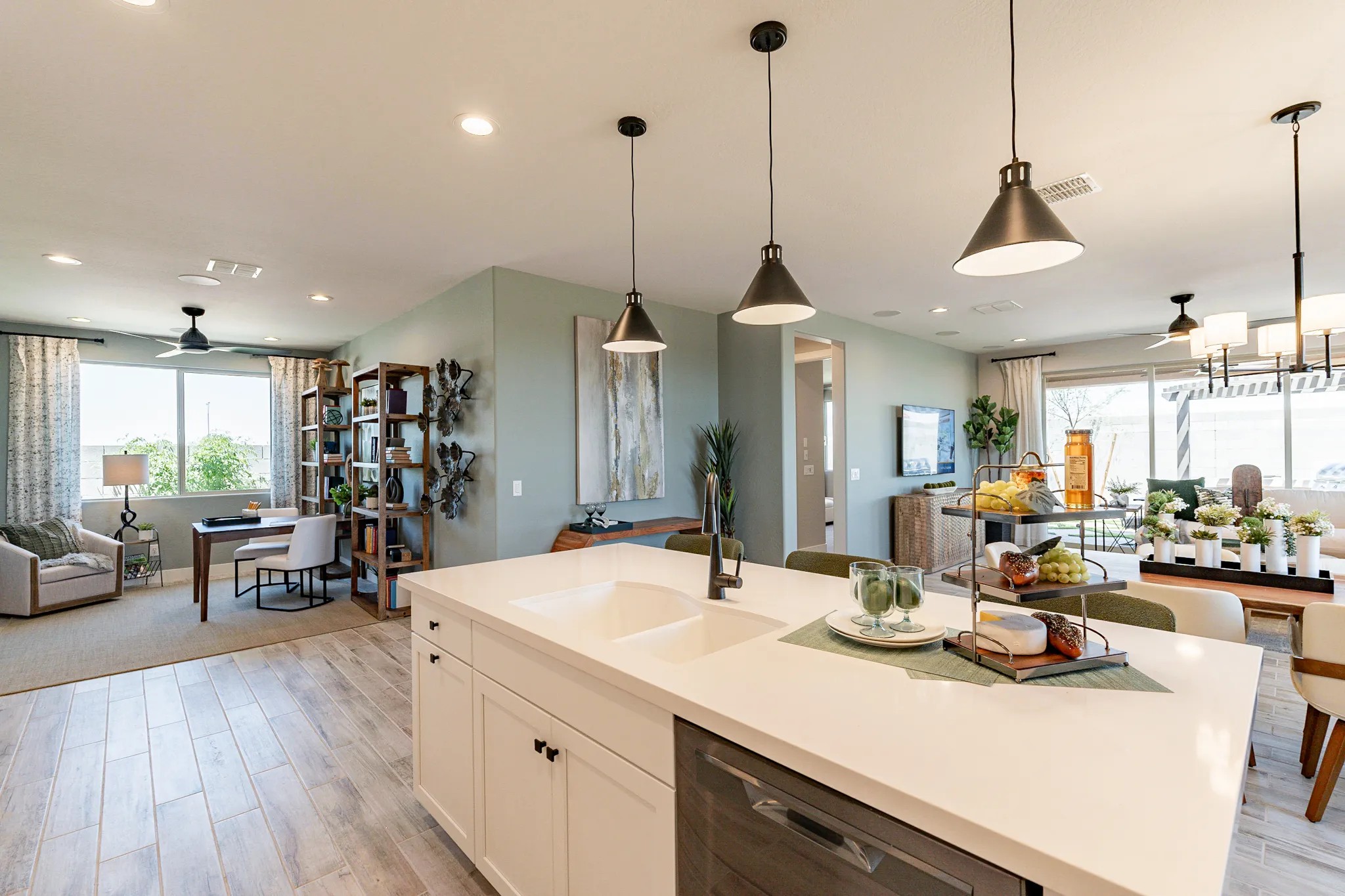 Open-Concept Kitchen with Island in Sienna Park Modern open-concept kitchen with island, pendant lights, and dining area in Sienna Park. Natural light floods space.