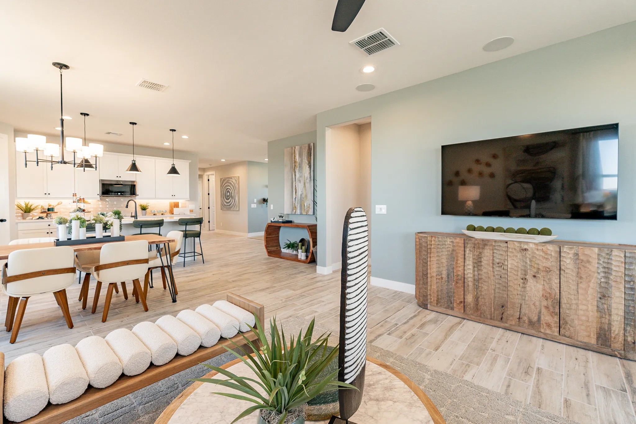 Sienna Park Open-Concept Living Room and Kitchen Design Modern open-concept living room and kitchen with chic lighting in Sienna Park community.