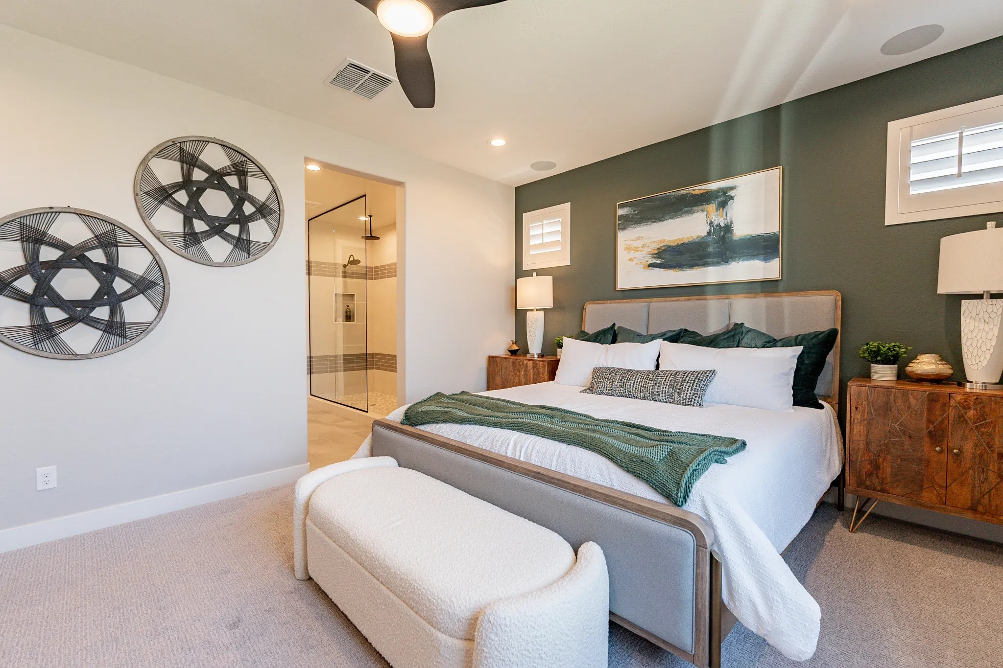 Modern Bedroom with Ensuite in Sienna Park Community Elegant bedroom with modern decor, large bed, and ensuite bathroom in Sienna Park. Features wall art and chic lighting.