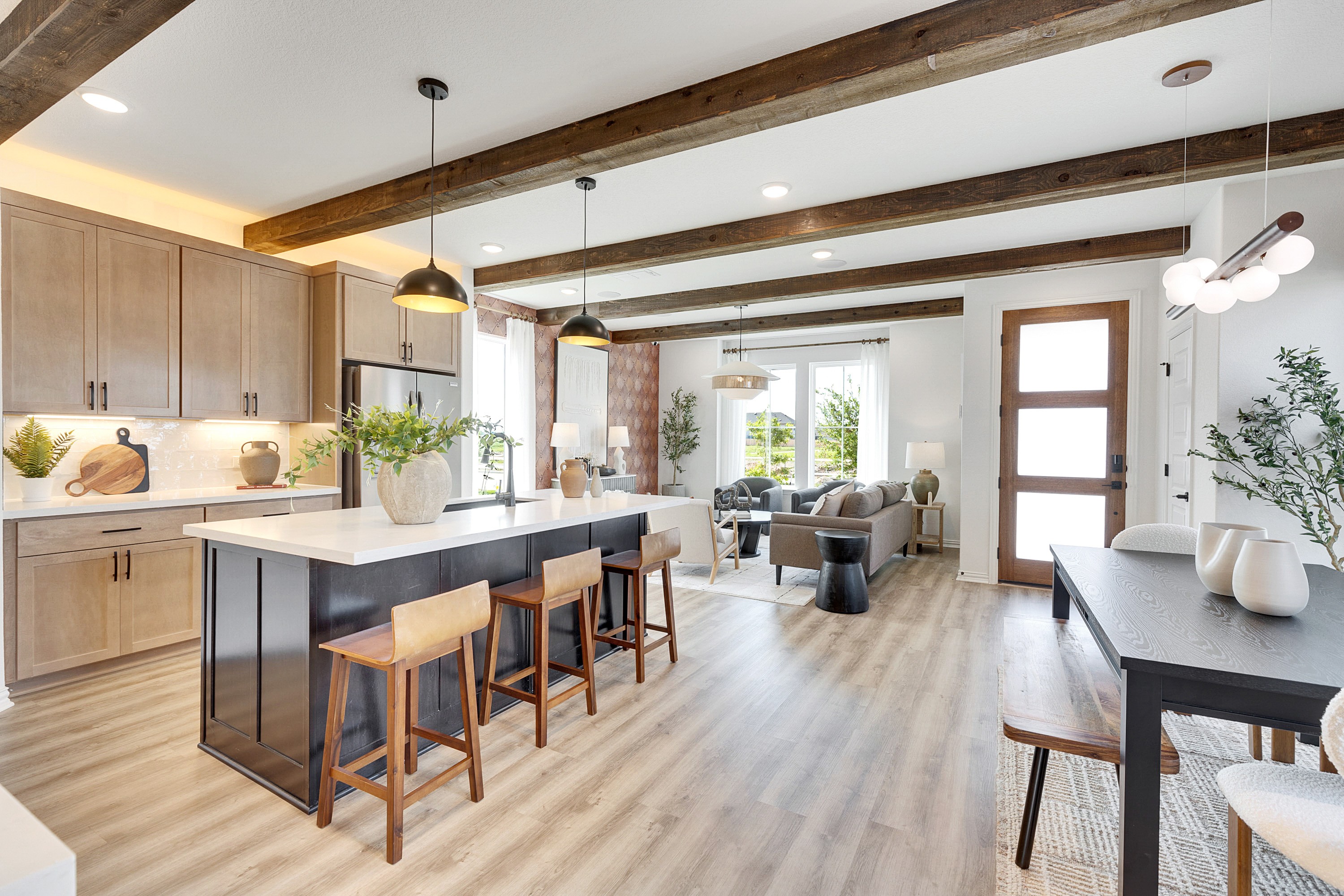 Luxurious Open Kitchen and Living Area in Spring Creek Elegant kitchen, living space with wood beams, modern design, bright natural light in Spring Creek.