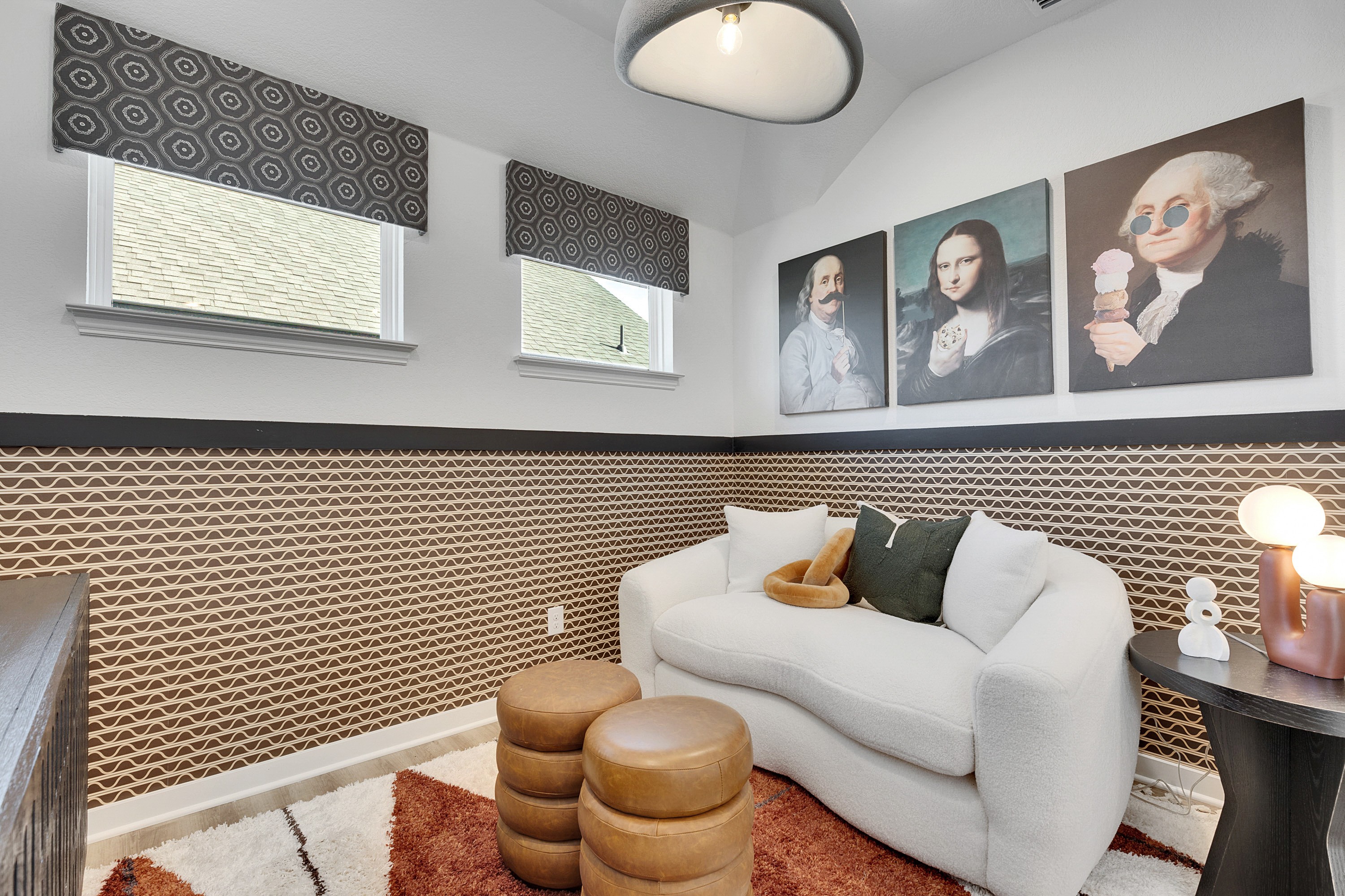 Stylish Living Room with Modern Art in Spring Creek Elegant living room with geometric wallpaper, modern art, plush white sofa in Spring Creek.