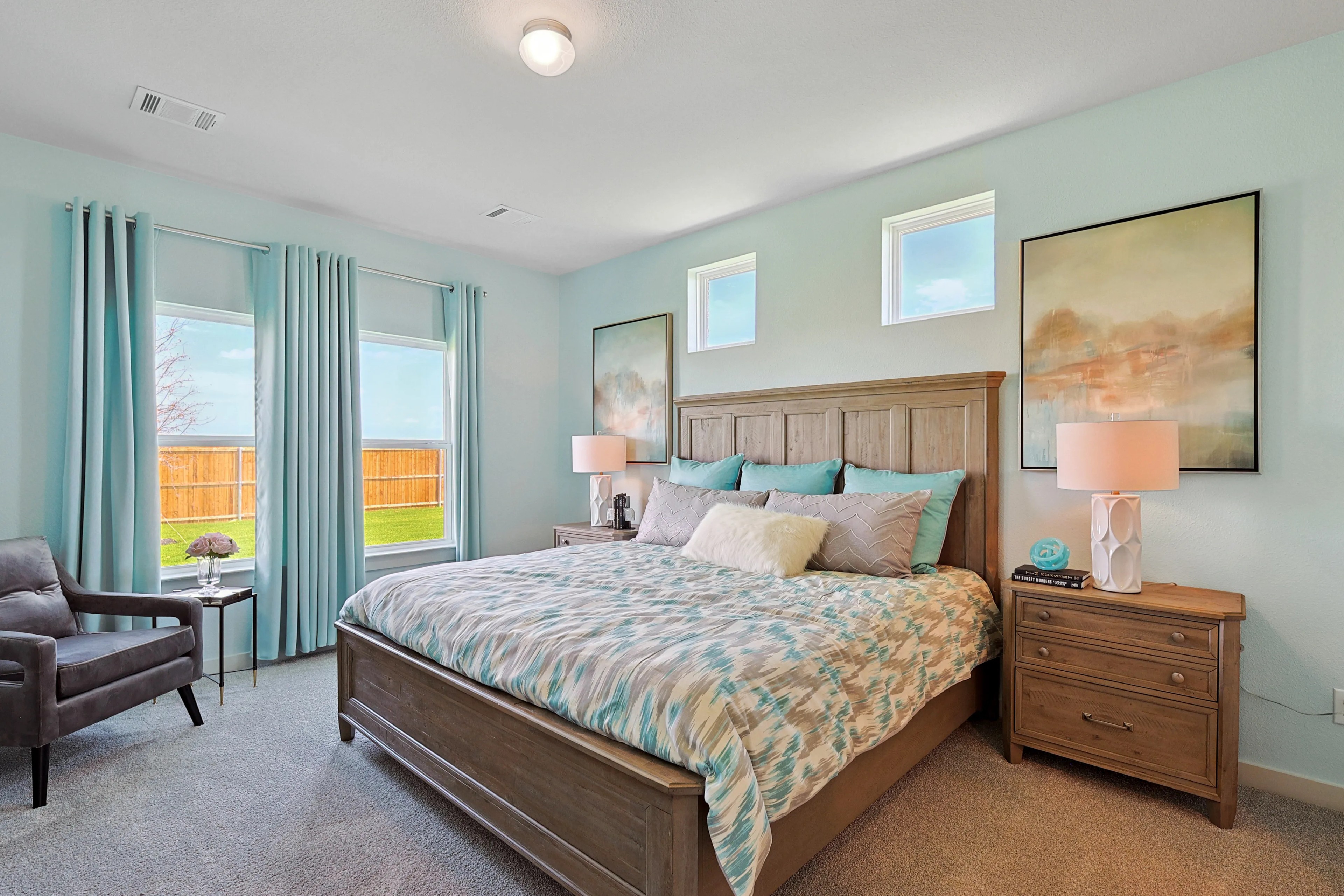 Spacious Bedroom in Patriot Estates Community Elegant bedroom with wooden bedframe and large windows, Patriot Estates community.