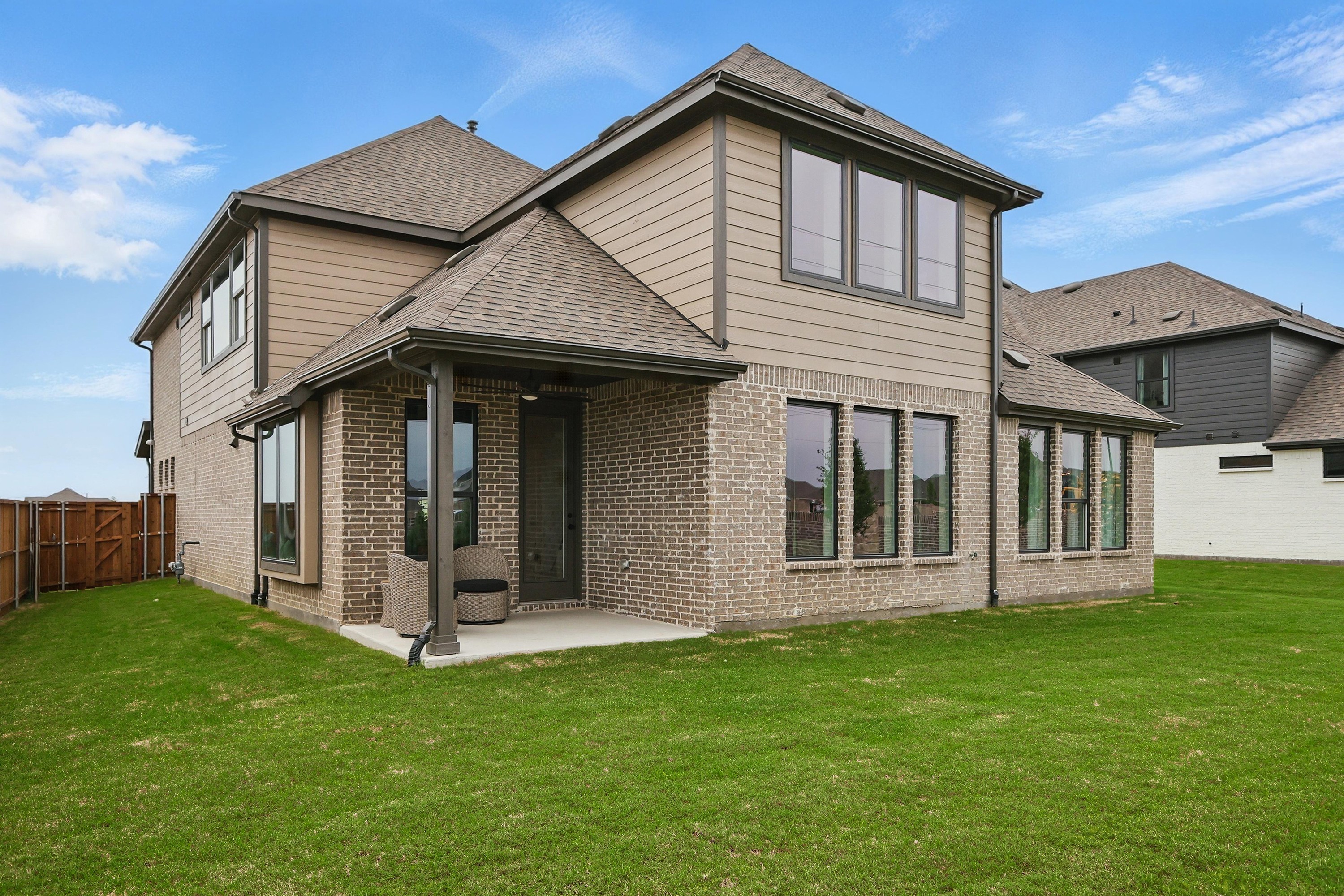 Modern Two-Story Brick Home in Westridge with Spacious Backyard Modern brick two-story home in Westridge community with spacious backyard and large windows.