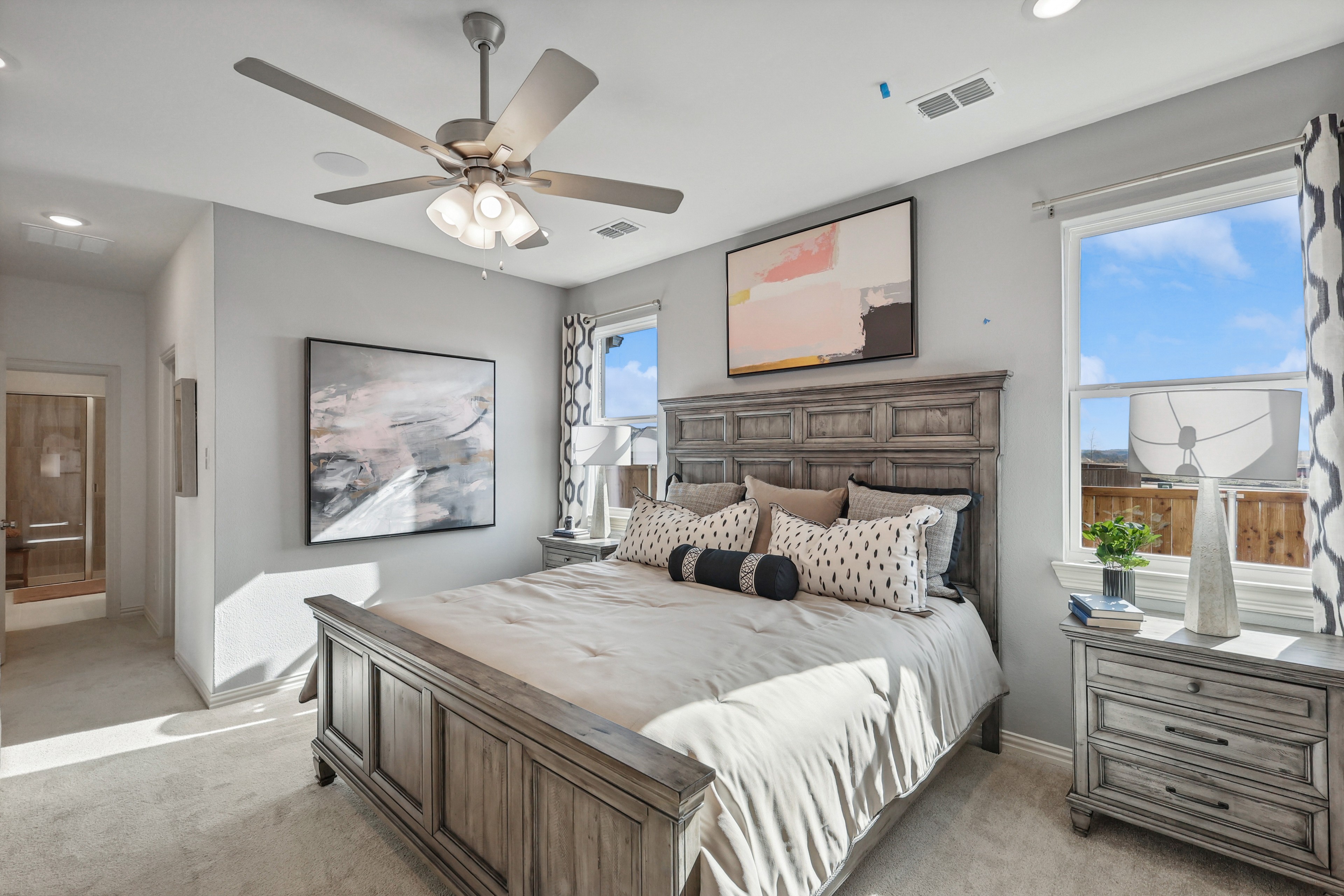 Luxurious Bedroom Design in Bel Air Village with Wooden Accents Elegant bedroom in Bel Air Village with wooden furniture, modern art, and natural light. Luxurious and serene atmosphere.