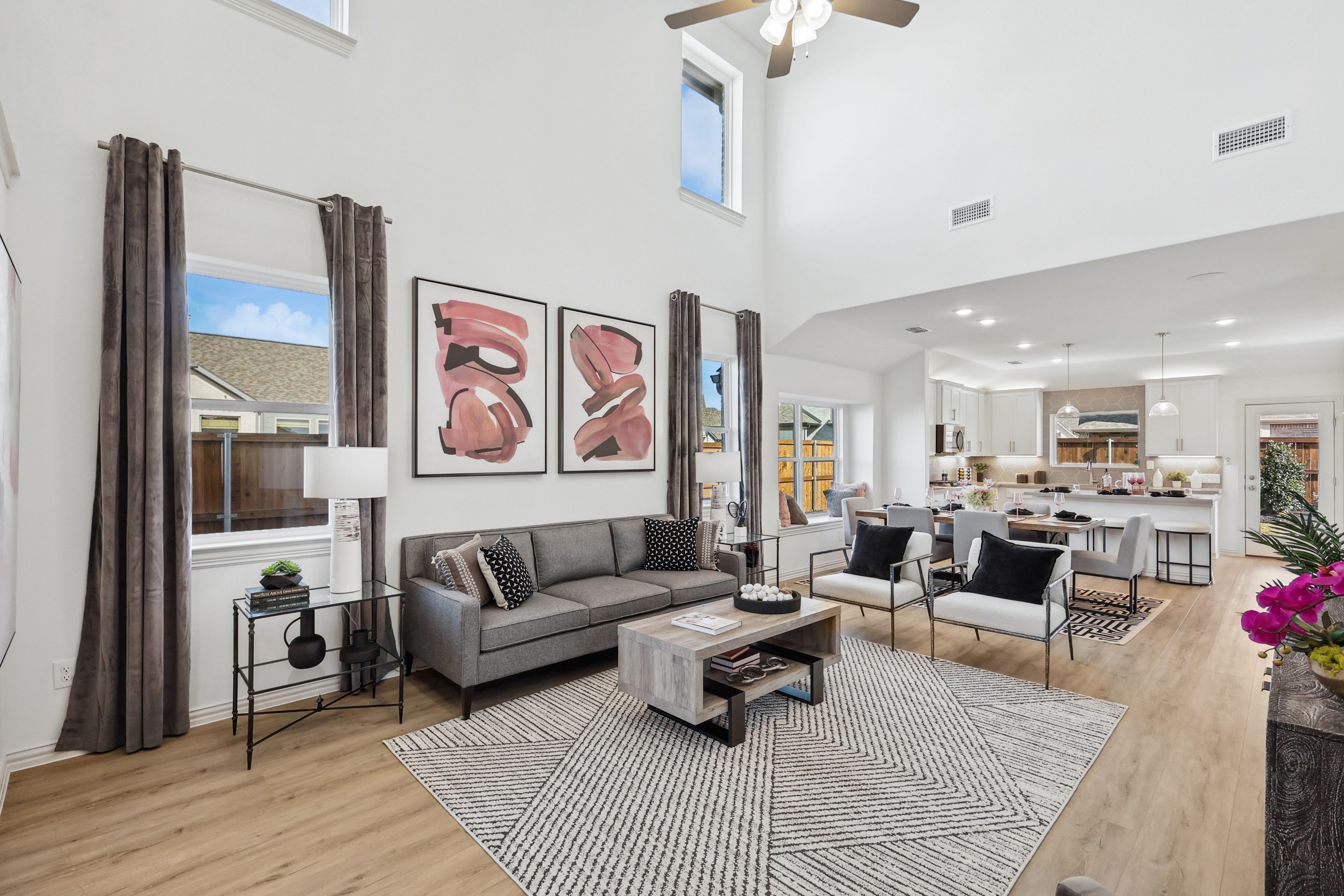 Open-Concept Living Area in Bel Air Village with High Ceilings Modern Bel Air Village open-concept living area with high ceilings, hardwood floors, and stylish decor.