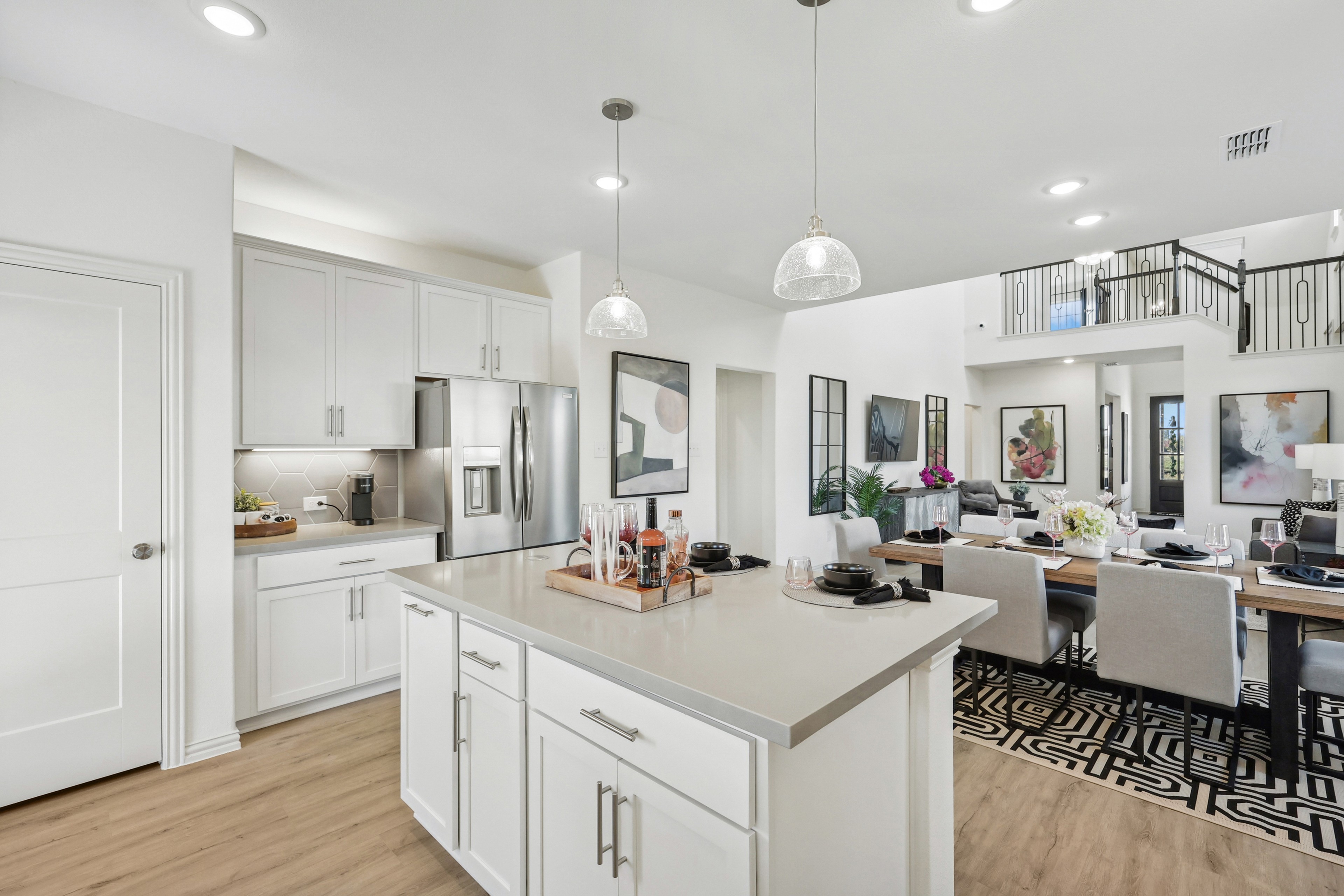 Contemporary Kitchen in Bel Air Village with Modern Dining Space Modern kitchen with island, stainless steel appliances, and open dining area in Bel Air Village.
