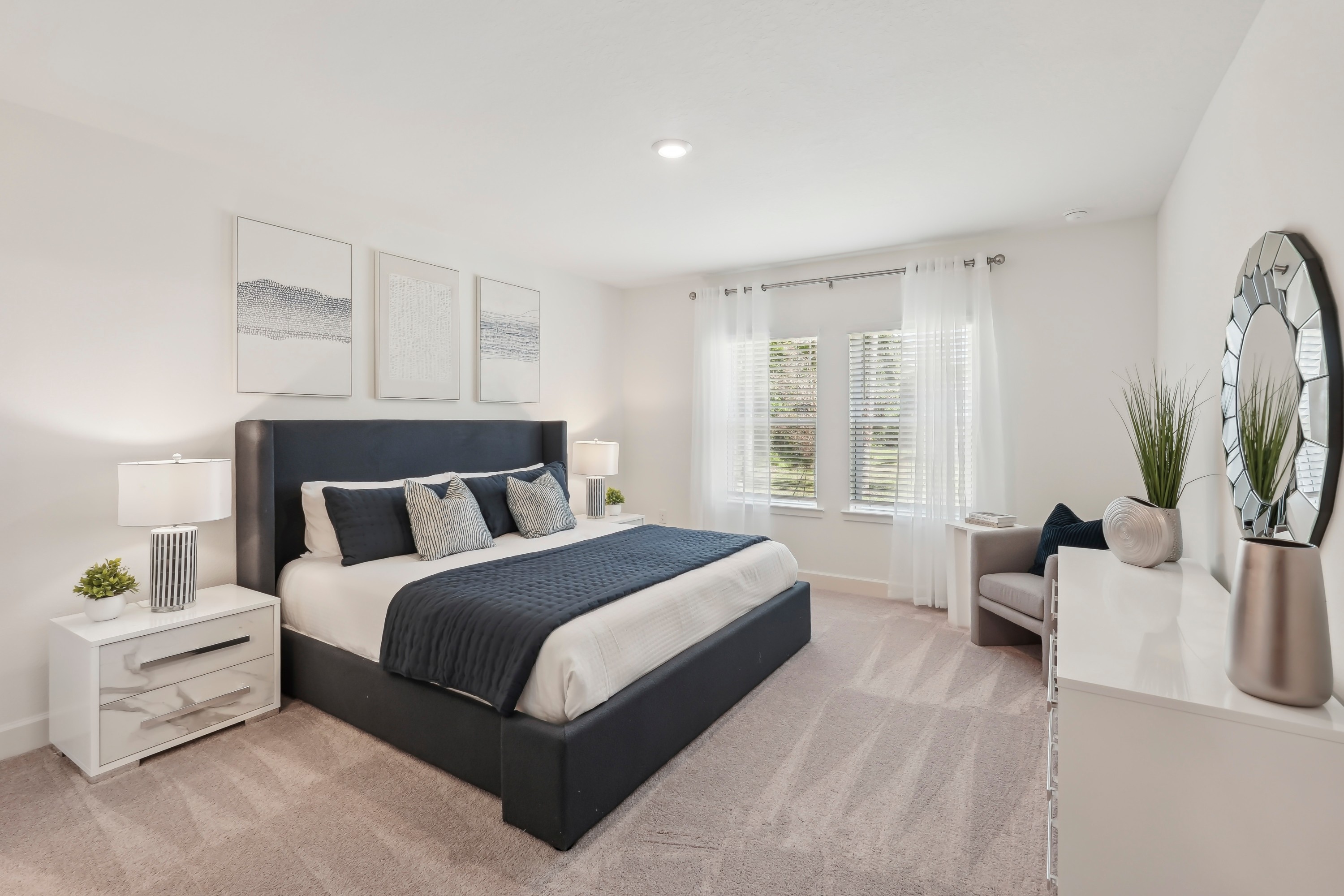 North Port Bedroom with Navy Accents and Modern Decor Elegant bedroom with large window, navy accents, and contemporary decor in North Port.