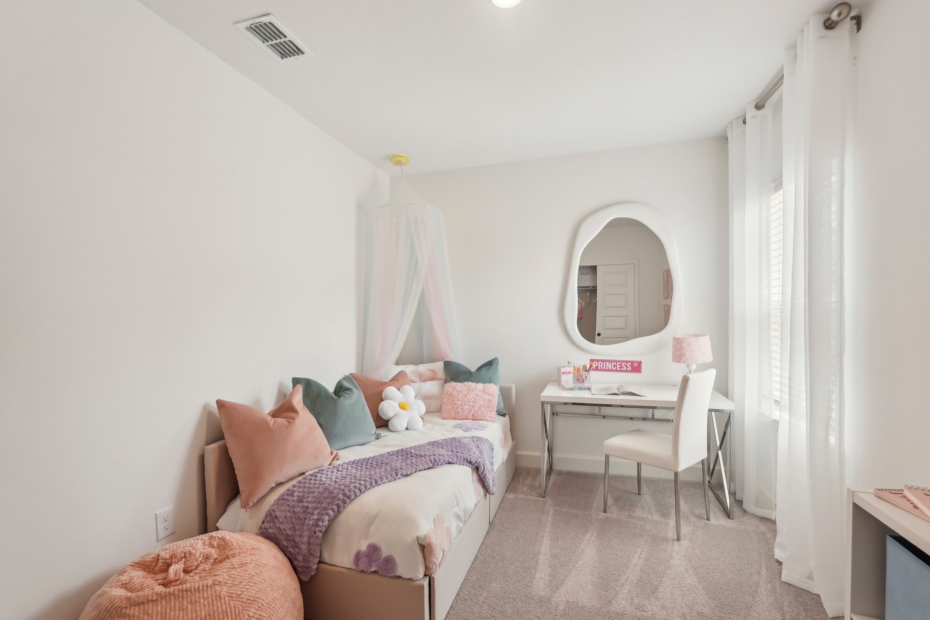 Chic Kids' Bedroom with Pastel Decor in North Port Elegant kids' bedroom with pastel decor, North Port; features canopy bed, modern desk.