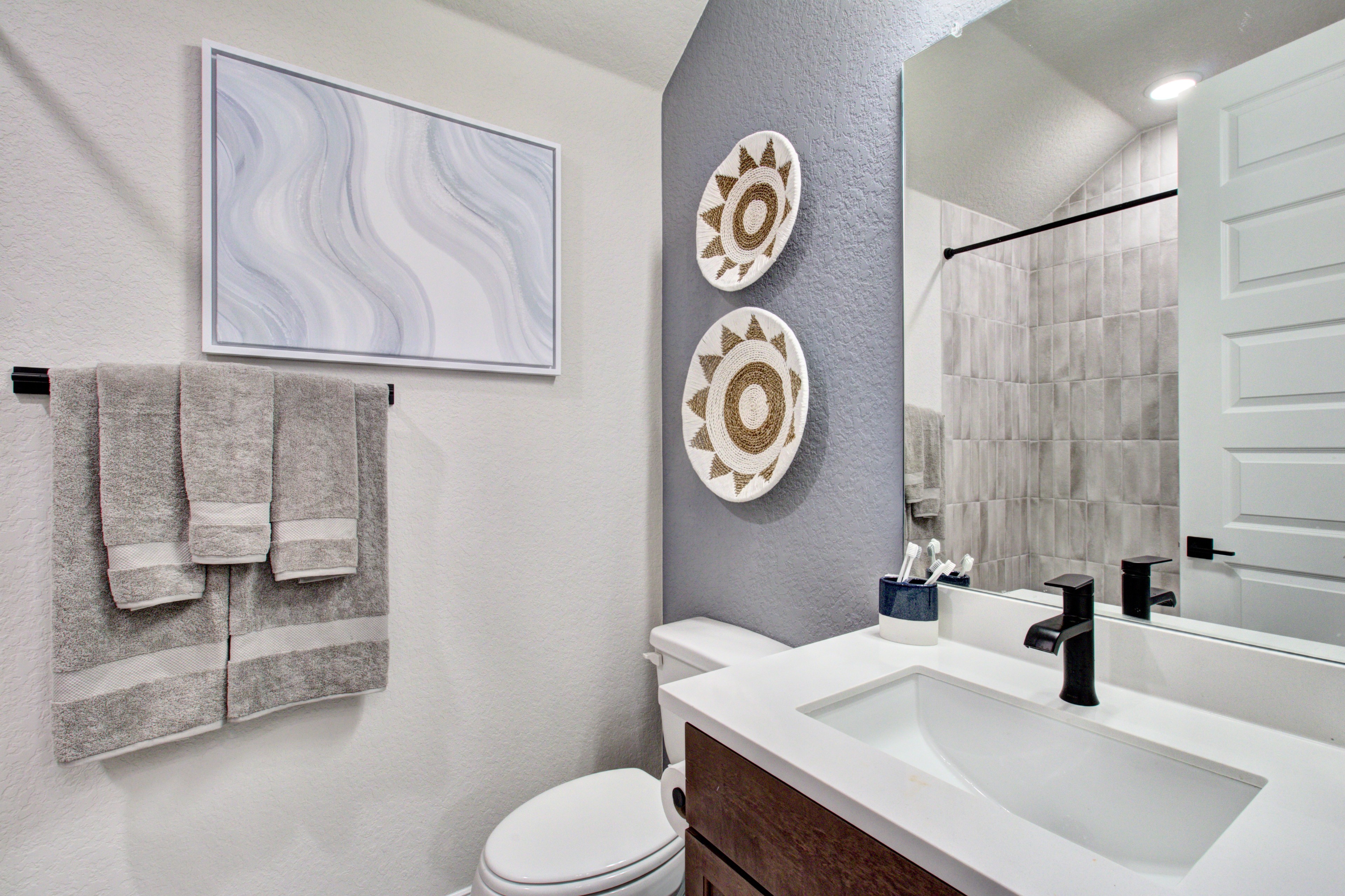 Sunflower Ridge Bathroom with Modern Design and Art Decor Elegant bathroom with modern tiles, sleek fixtures, and art decor, Sunflower Ridge.