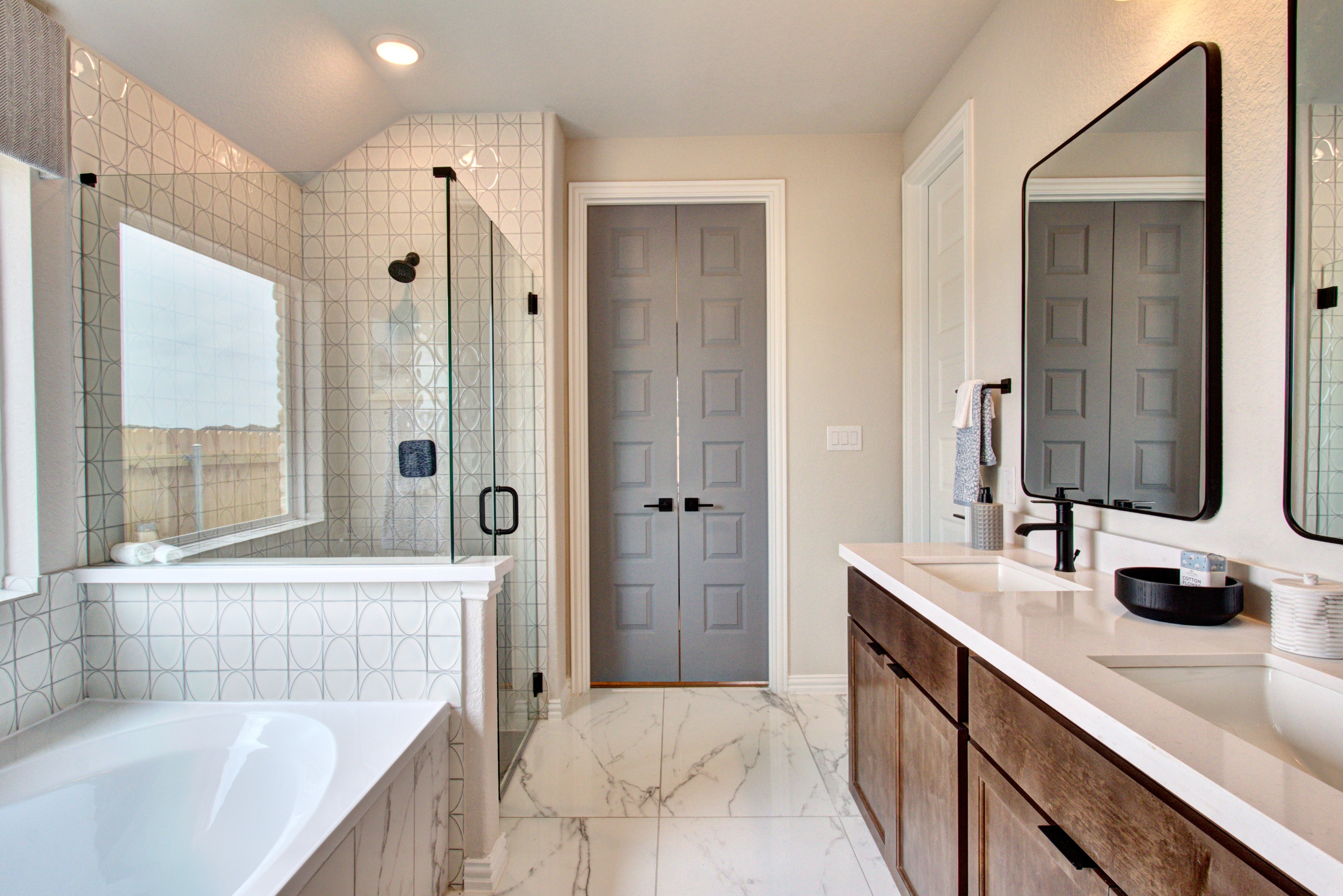 Sunflower Ridge Luxury Bathroom with Marble and Glass Shower Luxurious Sunflower Ridge bathroom features marble flooring, double vanity, glass shower, modern design.