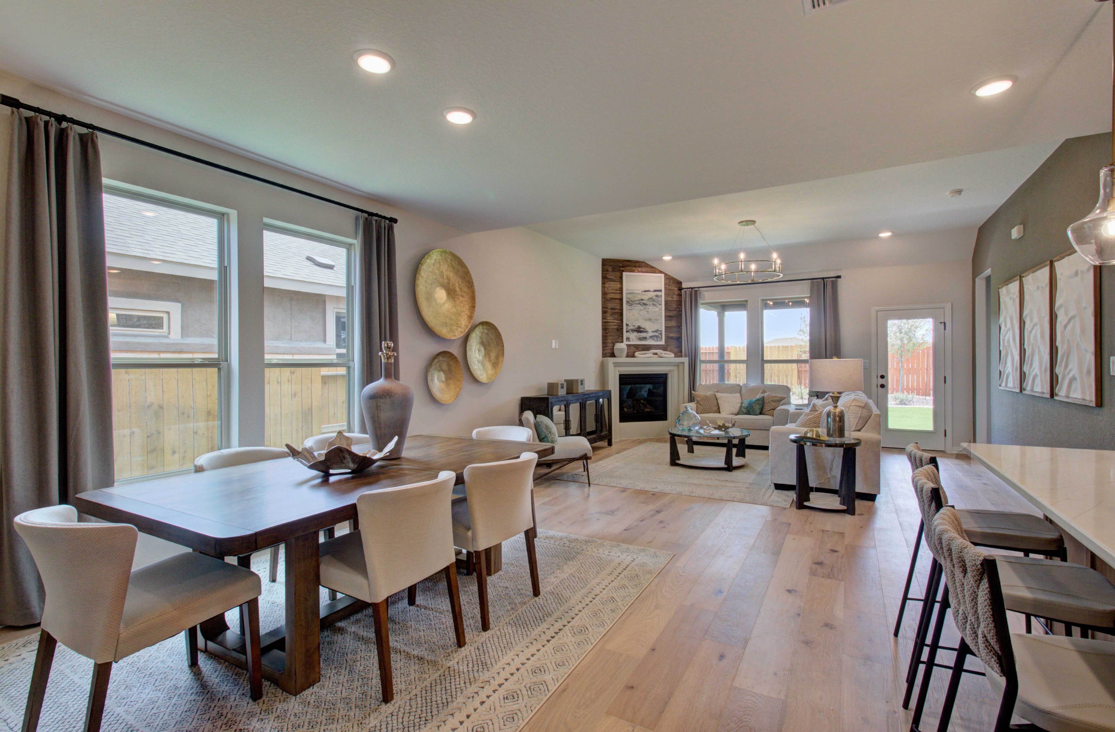 Meyer Ranch Living Room with Hardwood Floors and Modern Decor Spacious living area in Meyer Ranch with modern decor, hardwood floors, elegant lighting, and a cozy fireplace.