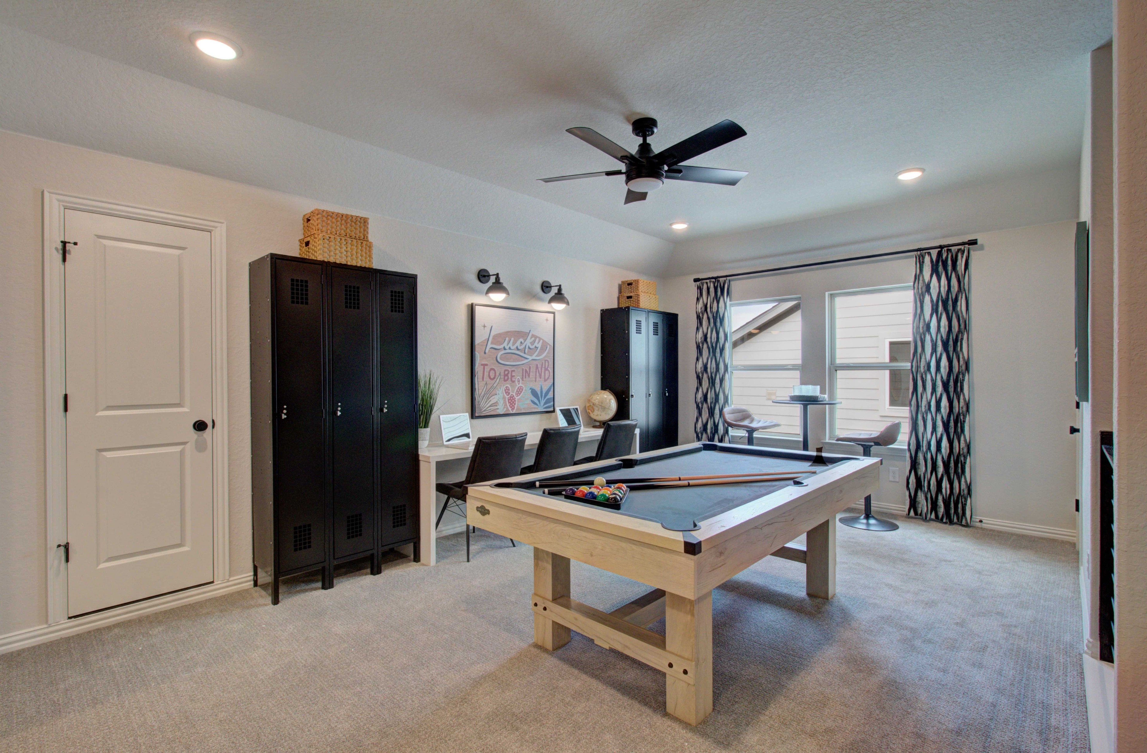 Stylish Game Room in Meyer Ranch Featuring Pool Table Game room with pool table, lockers, and seating; modern lighting; Meyer Ranch location.