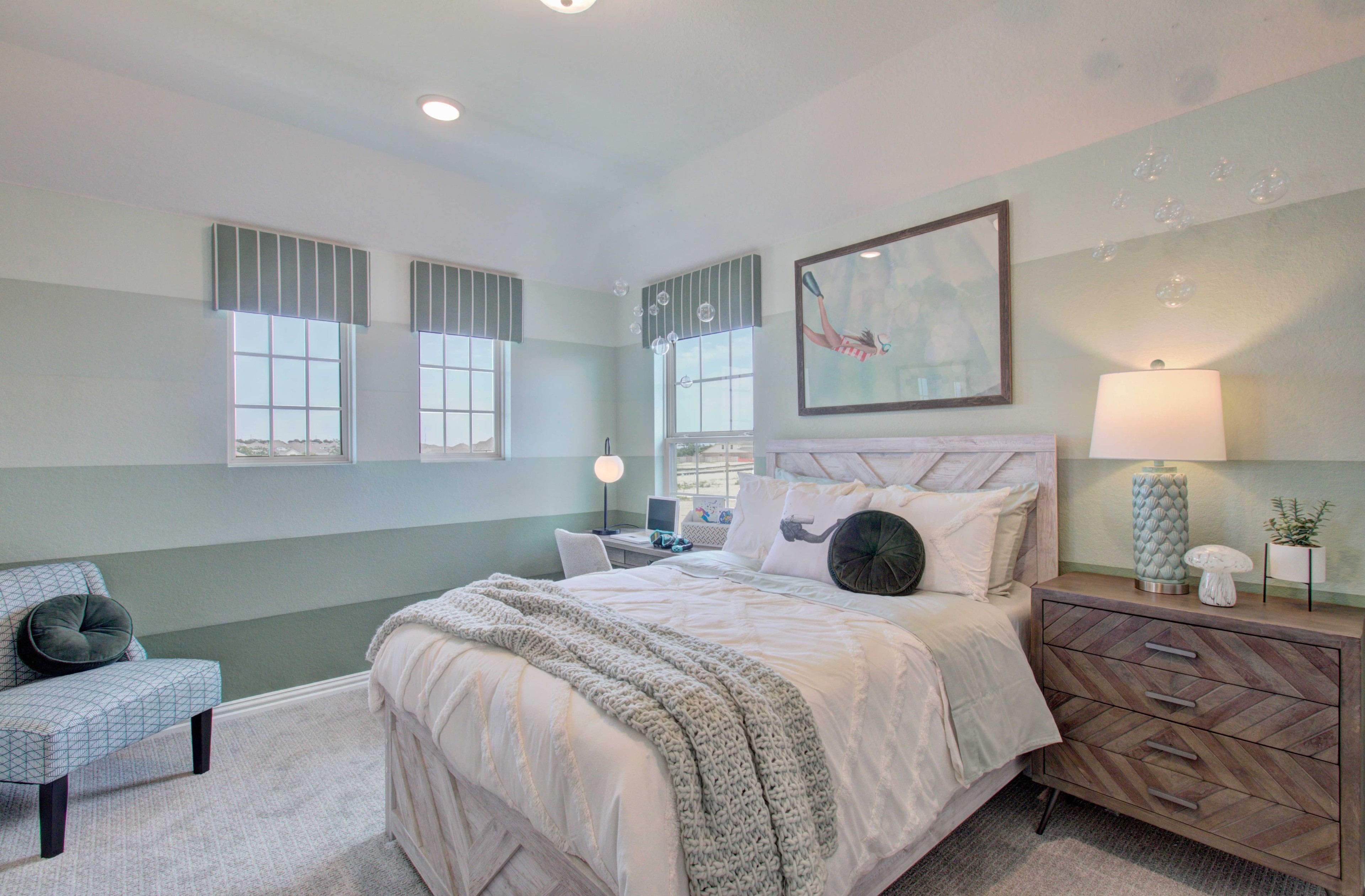 Stylish Bedroom at Meyer Ranch Enclave Community Elegant bedroom with striped walls, large windows, and stylish decor at Meyer Ranch, Enclave Community.