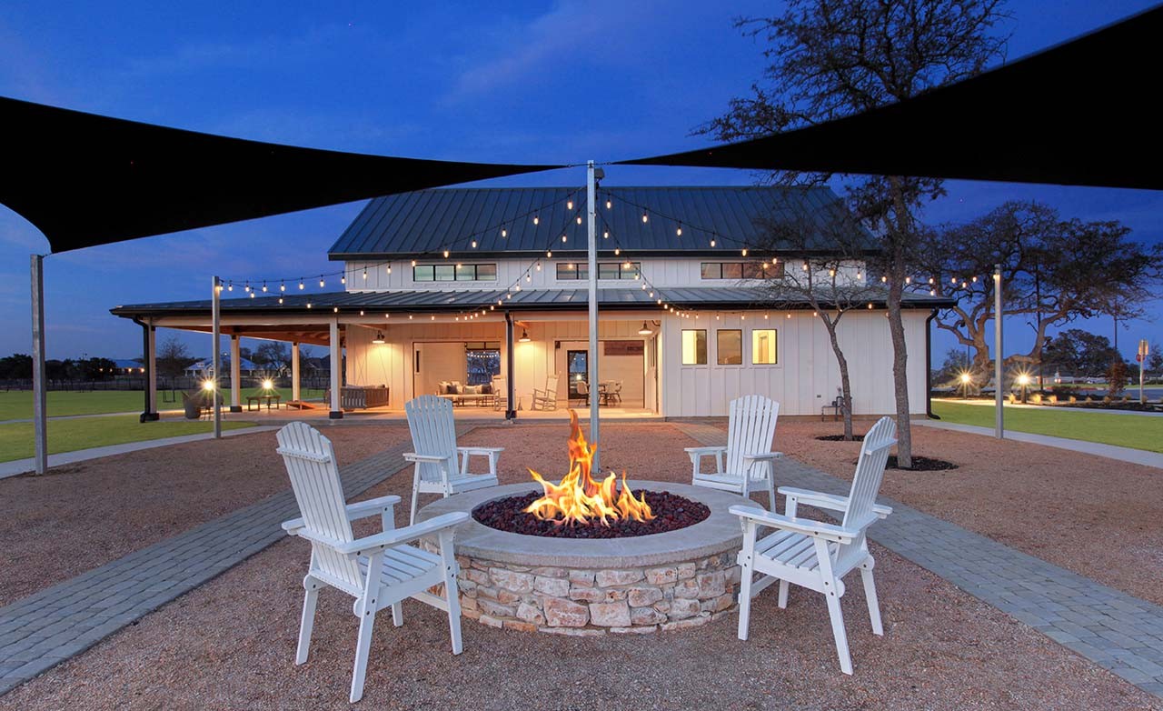 Luxury Enclave Fire Pit and Modern Barn, Meyer Ranch Community Enclave community with modern barn-style building, fire pit, and string lights, Meyer Ranch, open night sky.