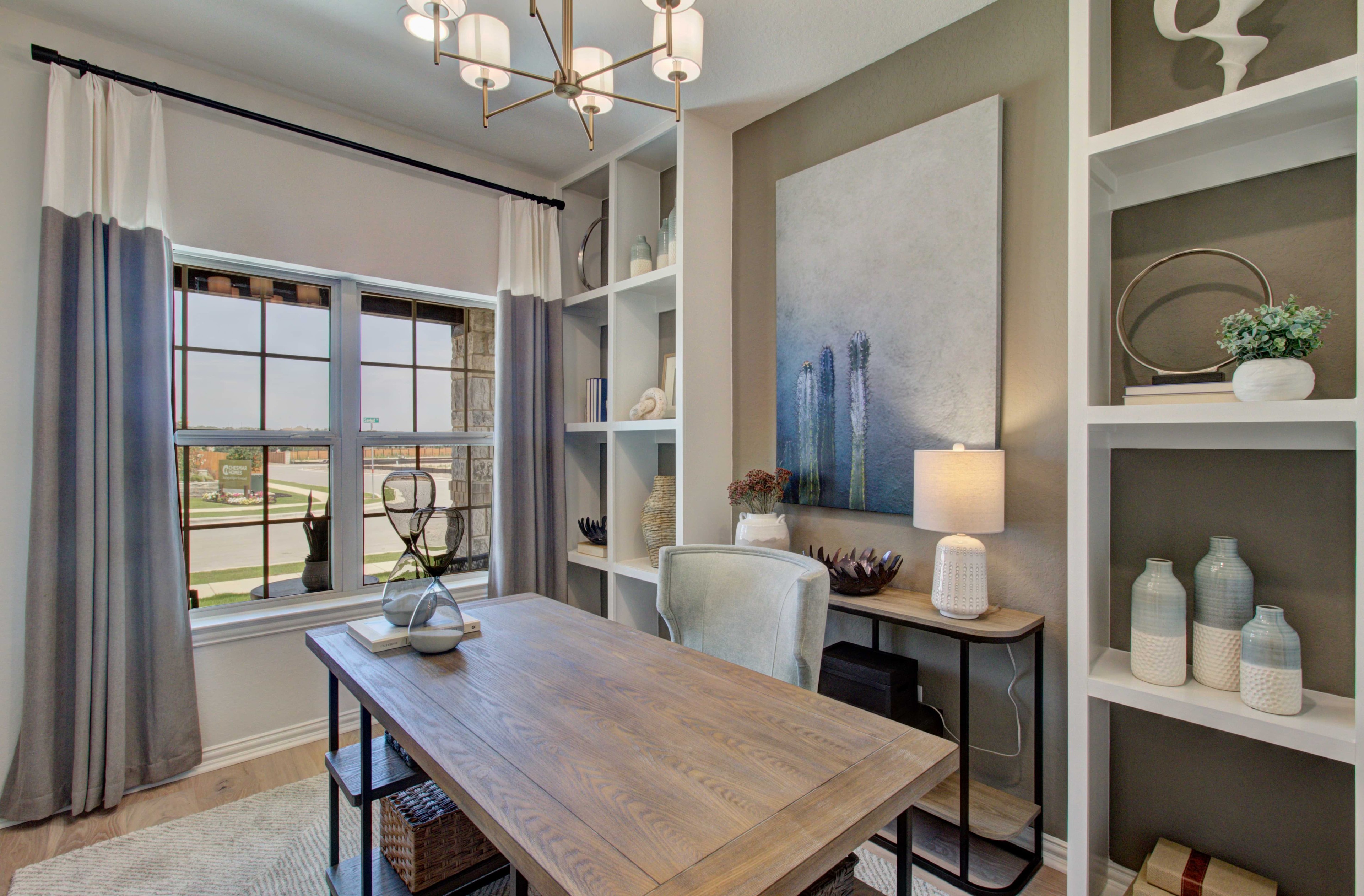 Meyer Ranch Enclave Home Office with Built-In Shelves Modern home office with wooden desk, built-in shelves, artwork; located in Meyer Ranch, Enclave community.