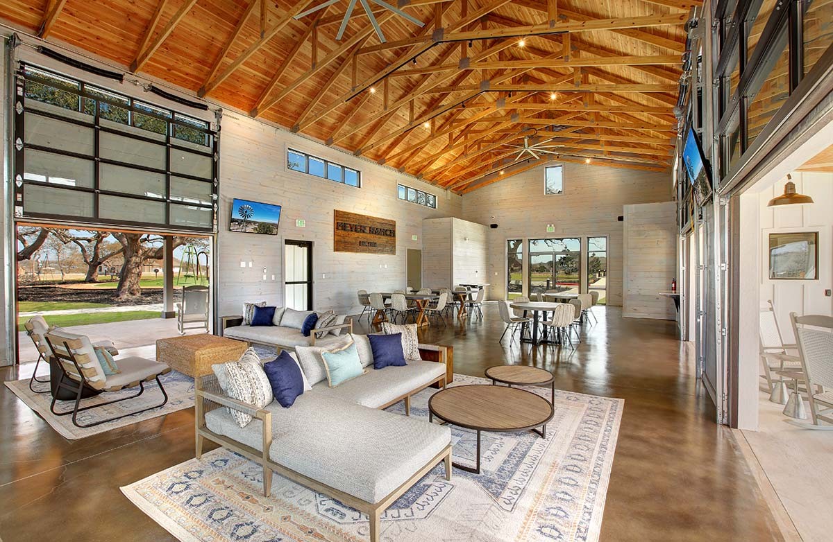 Meyer Ranch Clubhouse Interior with Timber Beams, New Braunfels Modern Meyer Ranch clubhouse with open timber beams, large windows, polished floors. New Braunfels, Texas.
