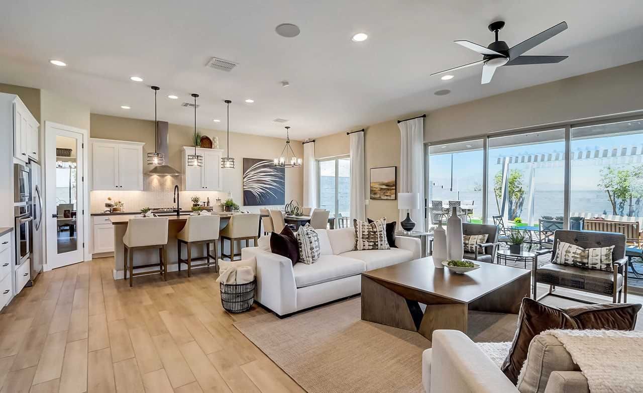 Luxurious Living Room with Canyon Views in Hacienda Community Modern open concept living room with kitchen, large windows, and canyon views in Hacienda community.