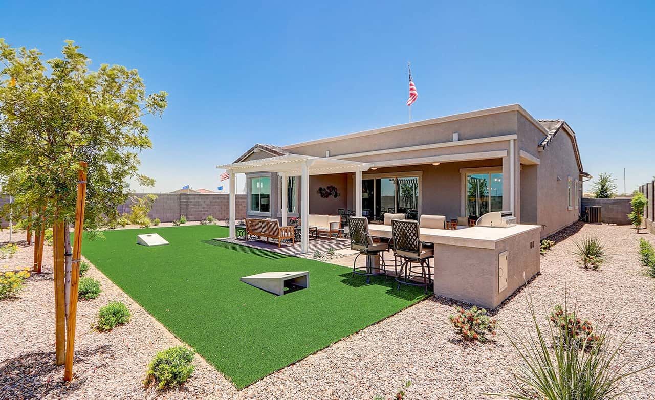 Hacienda Community Modern Home with Shaded Patio, Arizona Modern home with shaded patio and artificial grass in Hacienda community, Arizona desert setting.