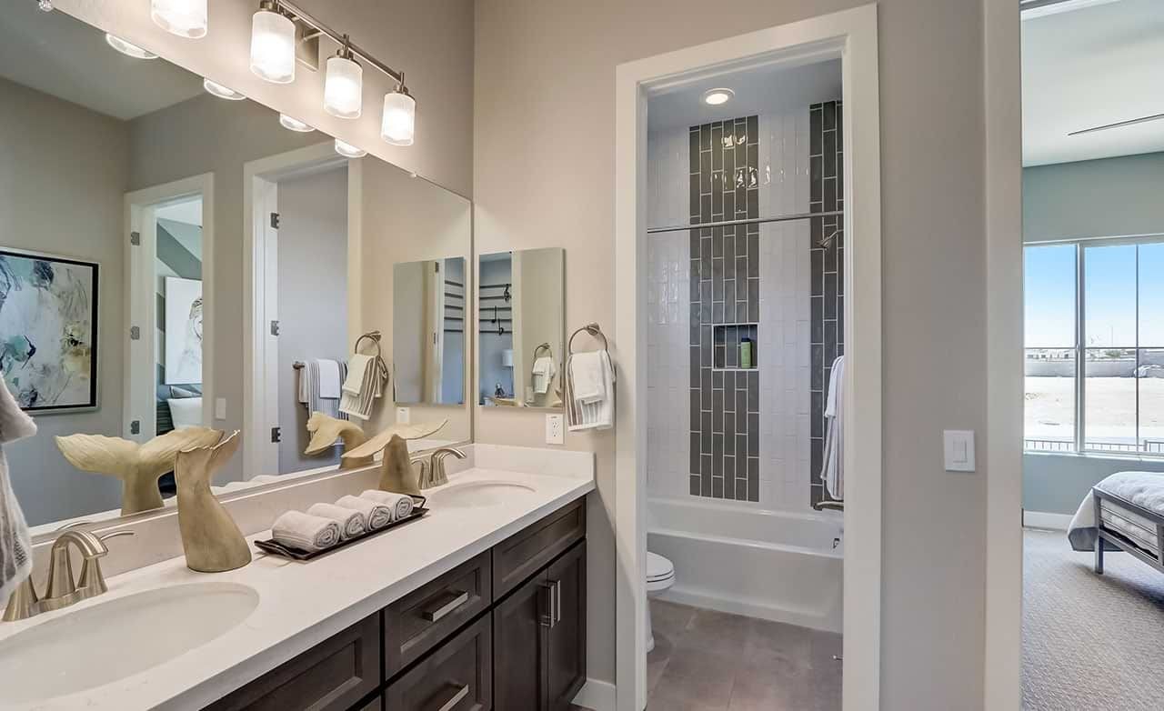 Modern Bathroom Design in Hacienda Community Near Canyon Views Modern bathroom with double sink, large mirror, stylish fixtures in Hacienda community near Canyon Views.