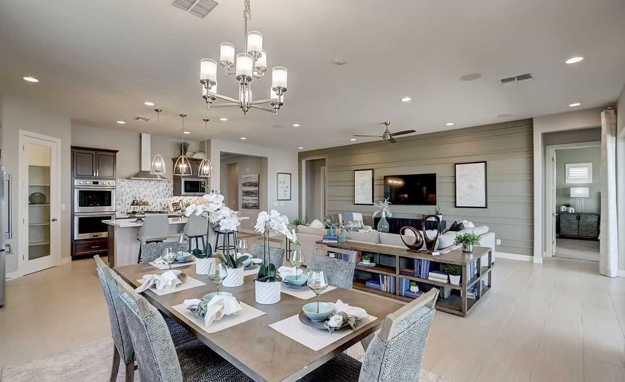 Open-Concept Living Room and Kitchen in Hacienda Community Modern open-concept living room and kitchen in Hacienda community. Features sleek cabinetry, elegant lighting, and a cozy ambiance.