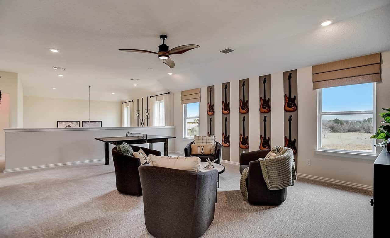 Elegant Living Space with Guitar Art in Casinas at Gruene, Texas Modern living area with guitar wall art, elegant seating, in Casinas at Gruene, Texas.