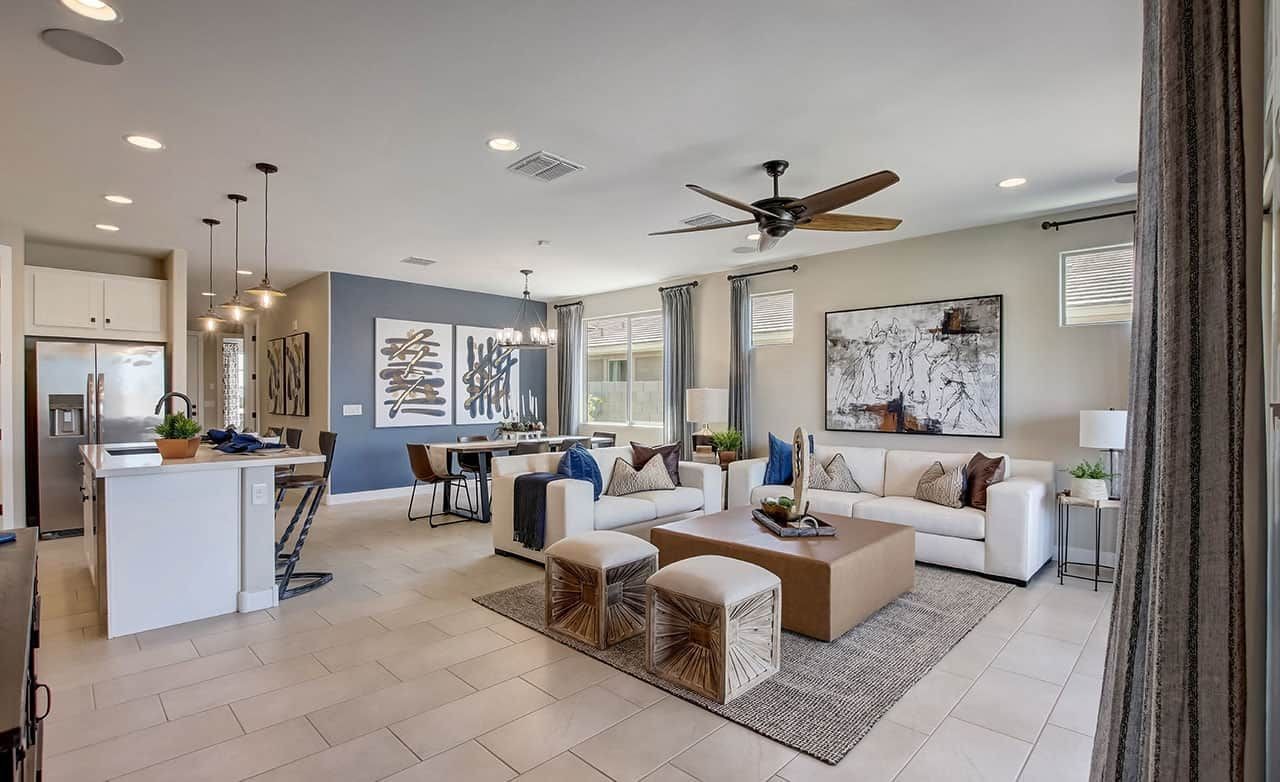 Modern Living Room in Castillo at Anderson Parc Modern open living room in Castillo at Anderson Parc with elegant decor, pendant lights, and large windows.