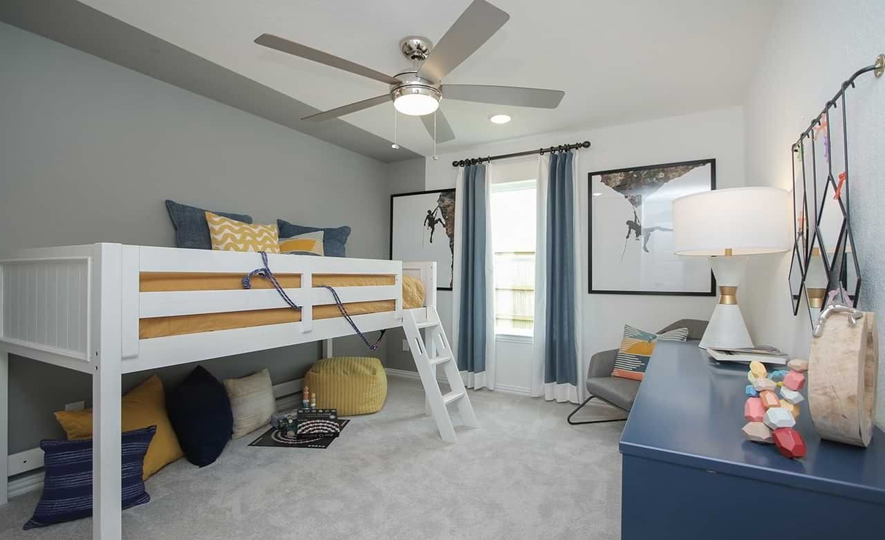 Child's Loft Bedroom with Modern Decor, Oakwood Estates Modern child's room with loft bed, ceiling fan, gray and yellow decor in Oakwood Estates. Large window, framed prints.