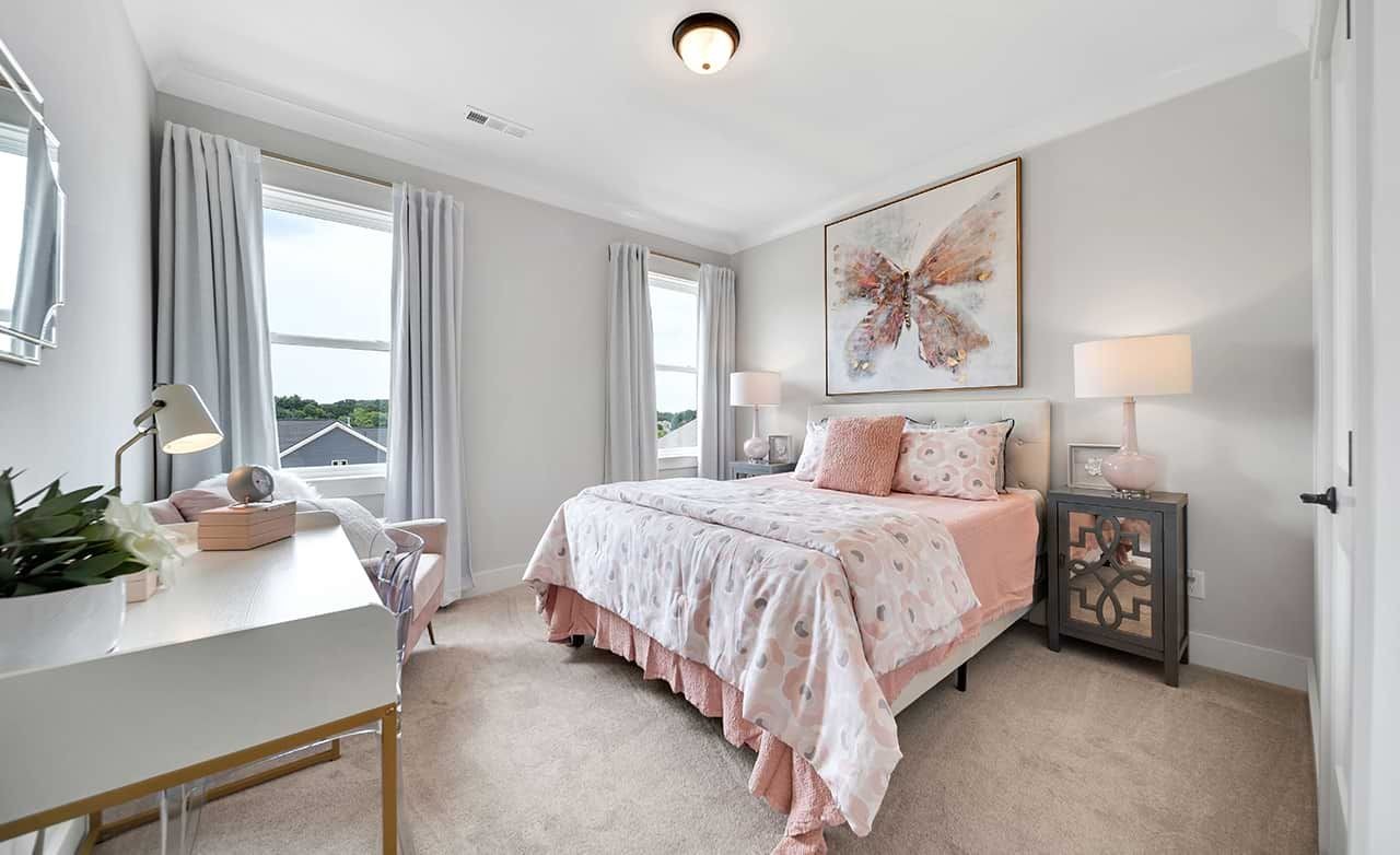 Elegant Bedroom with Pastel Decor in Richvale Estates Elegant bedroom with pastel decor, abstract artwork, and large windows in Richvale Estates. Carpet flooring.