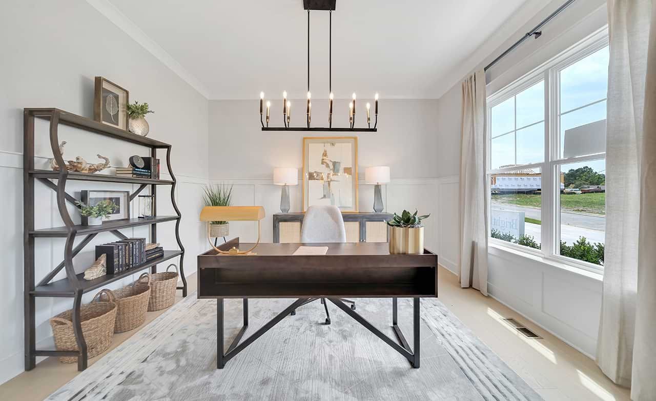 Modern Home Office Design in Richvale Estates Elegant home office with large window, sleek desk, and modern decor in Richvale Estates. Bright and inviting space.