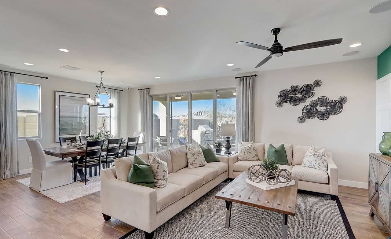 Stylish Living and Dining Room at Lakes at Rancho El Dorado, Arizona Modern living room and dining area with elegant decor and large windows, Lakes at Rancho El Dorado, Arizona.