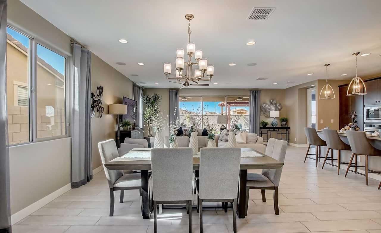 Elegant Dining and Living Space at The Lakes, Rancho El Dorado Modern dining and living area with chandelier, elegant decor, and open layout at The Lakes, Rancho El Dorado.