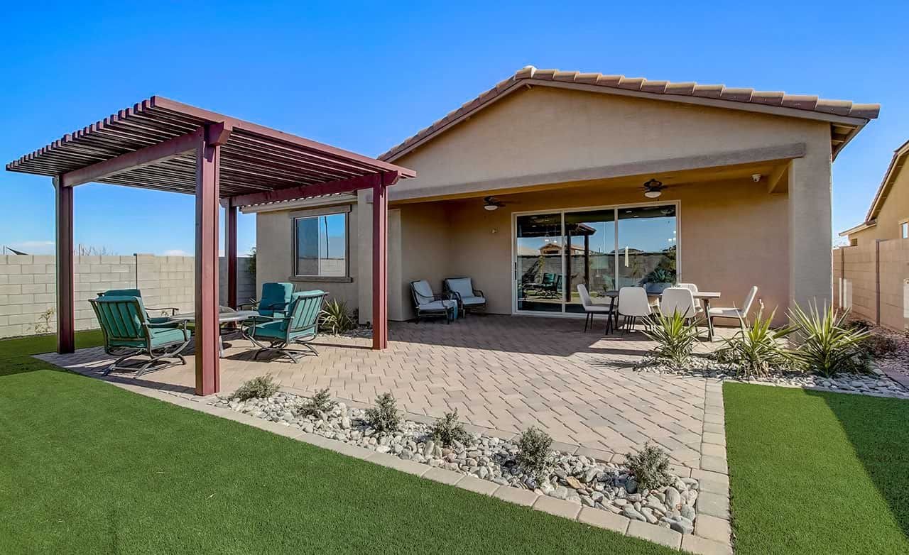 Modern Backyard with Pergola in Rancho El Dorado Modern backyard with pergola, patio furniture, stone walkway, and desert landscaping in Rancho El Dorado.